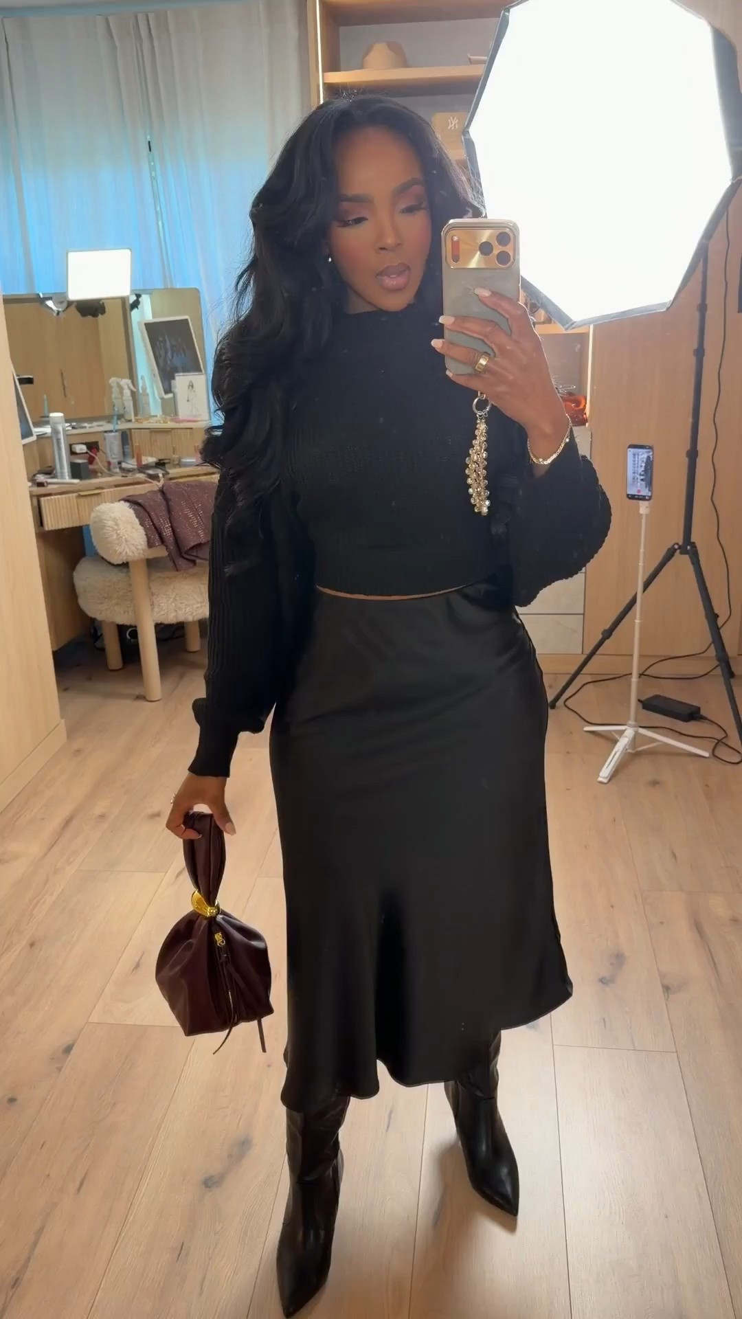 Effortlessly polished with a touch of drama ✨  
This all-black look is proof that texture, structure, and accessories do all the talking. Sleek, timeless, and styled to elevate your everyday wardrobe.

Perfect for dinner dates, wine tastings, holiday gatherings, or an elevated night out.

📏 Sizing:  
Top: Size Small  
Skirt: Size Small  
Boots: True to size  

A classic black outfit like this is a long-term shopping strategy — style it multiple ways and the cost per wear drops fast.

Save this post to revisit later or tap to get outfit details.  
Follow me on Instagram and YouTube @kirasfashionfinds

#LTKValentine #LTKvlog