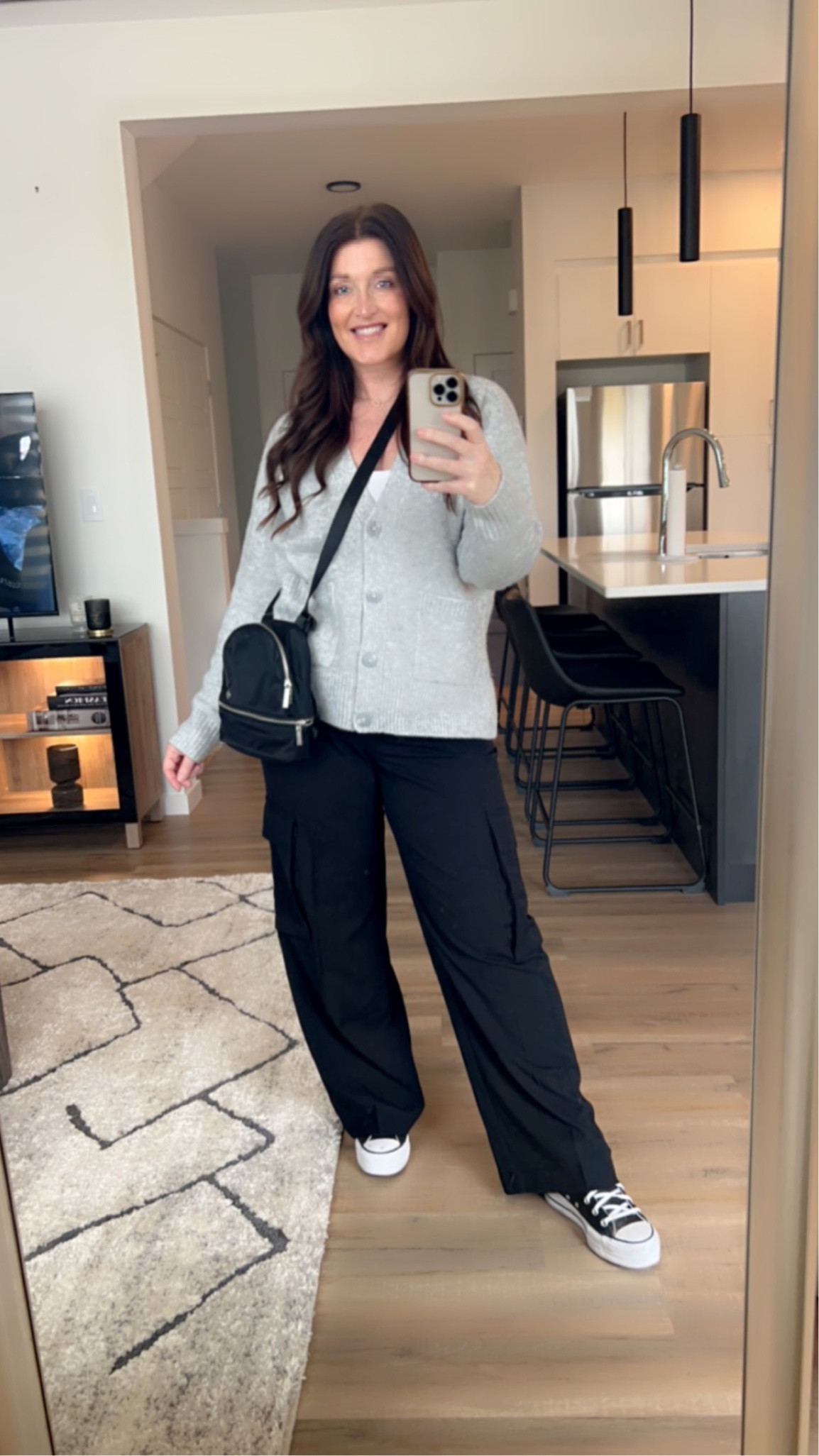 Ootd. Cardigan is actually from Marks but the link wouldn’t load so I found a really nice one comparable in price and fit/colour, I’m wearing a large. Cargo pants are pleated and very comfy and not too long on me, I’m 5’6” and I’m wearing a size 8. I love the Lululemon little micro backpack because it converts into a cross body bag  

#LTKover40 #LTKmidsize #LTKshoecrush