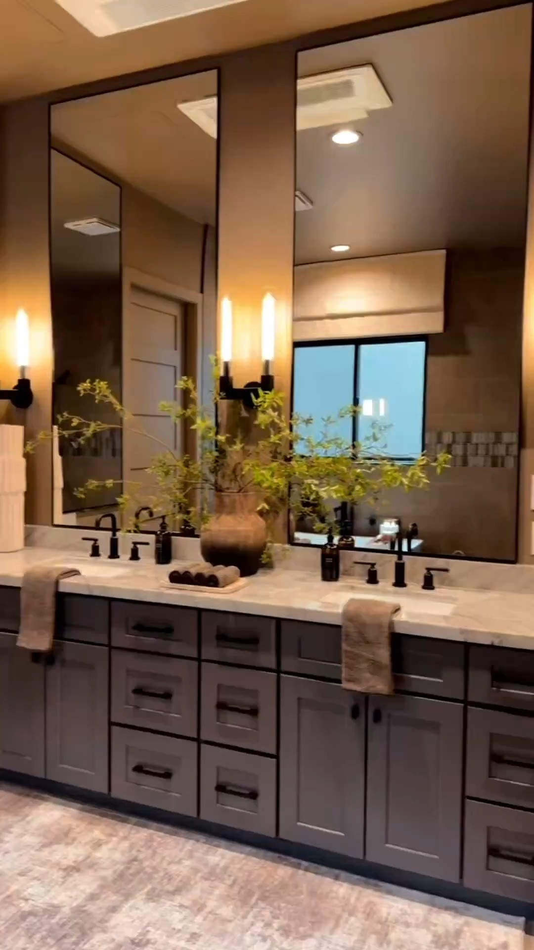 Mirrors are the best way to elevate any room! This is my master bathroom and it had to be ✨fabulous✨ so extra long mirrors were a must! Along with these stunning sconces and faux stems 😊

Modern neutral home decor 
Moody modern bathroom Inspo
Master bathroom decor Inspo
Elevated mirrors 
Affordable home decor ideas 
Oversized Mirrors 
Home Decor Tips 


Summerthompsonstyles 

 #LTKU #LTKHome #LTKSaleAlert