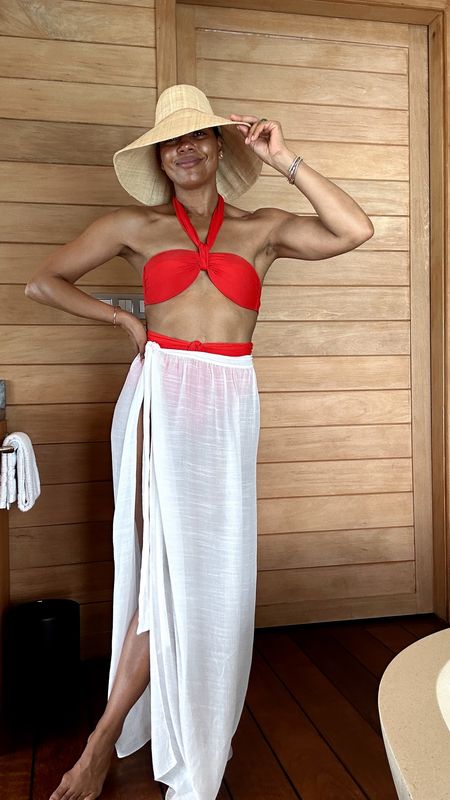 Absolutely love this red two piece swim suit. The pop of color is perfect for summer vacay. Paired with a tie cover up skirt and hat. 

#LTKSwim #LTKTravel #LTKOver40