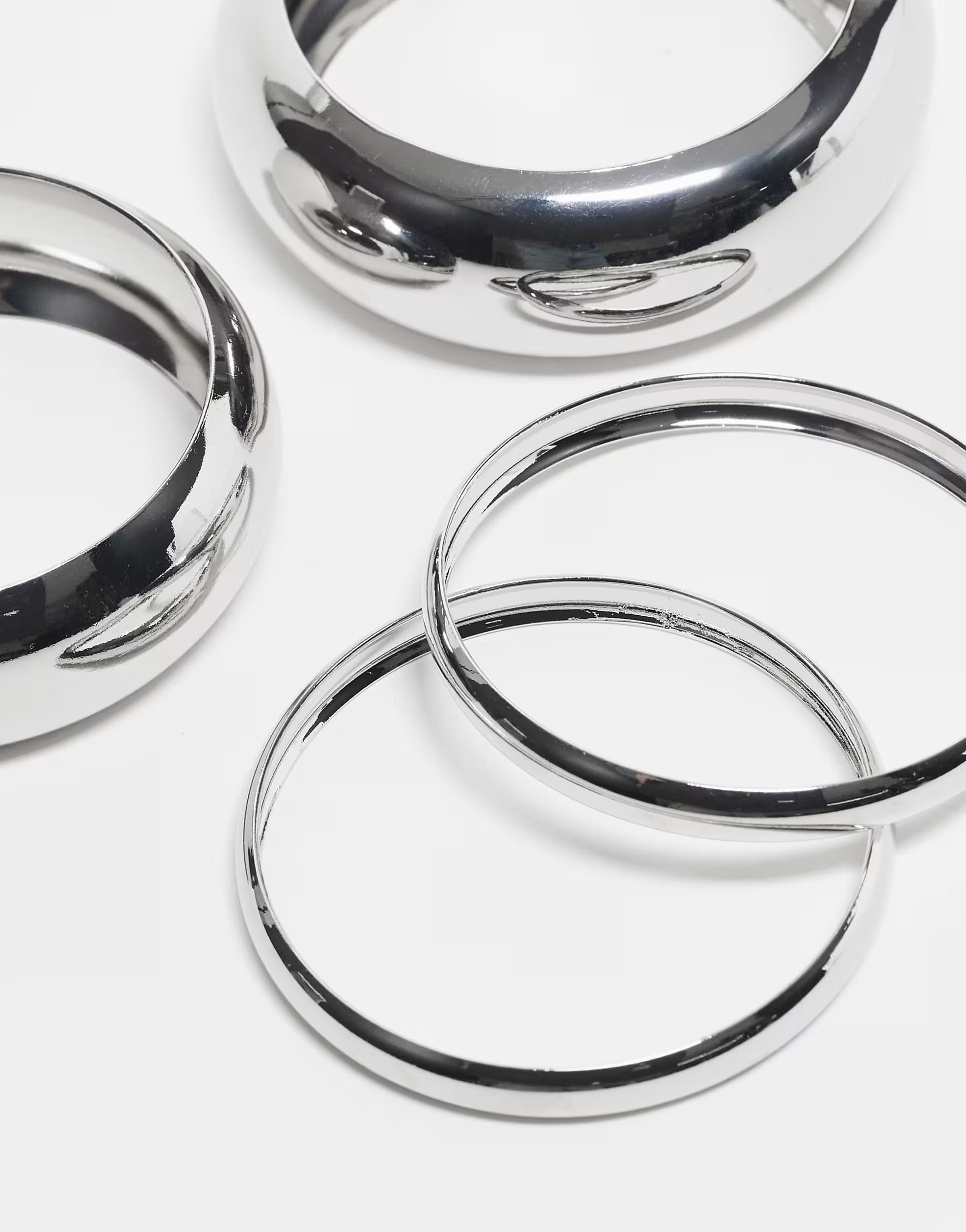 ASOS DESIGN pack of 4 bangle bracelets in mixed design in silver | ASOS (Global)