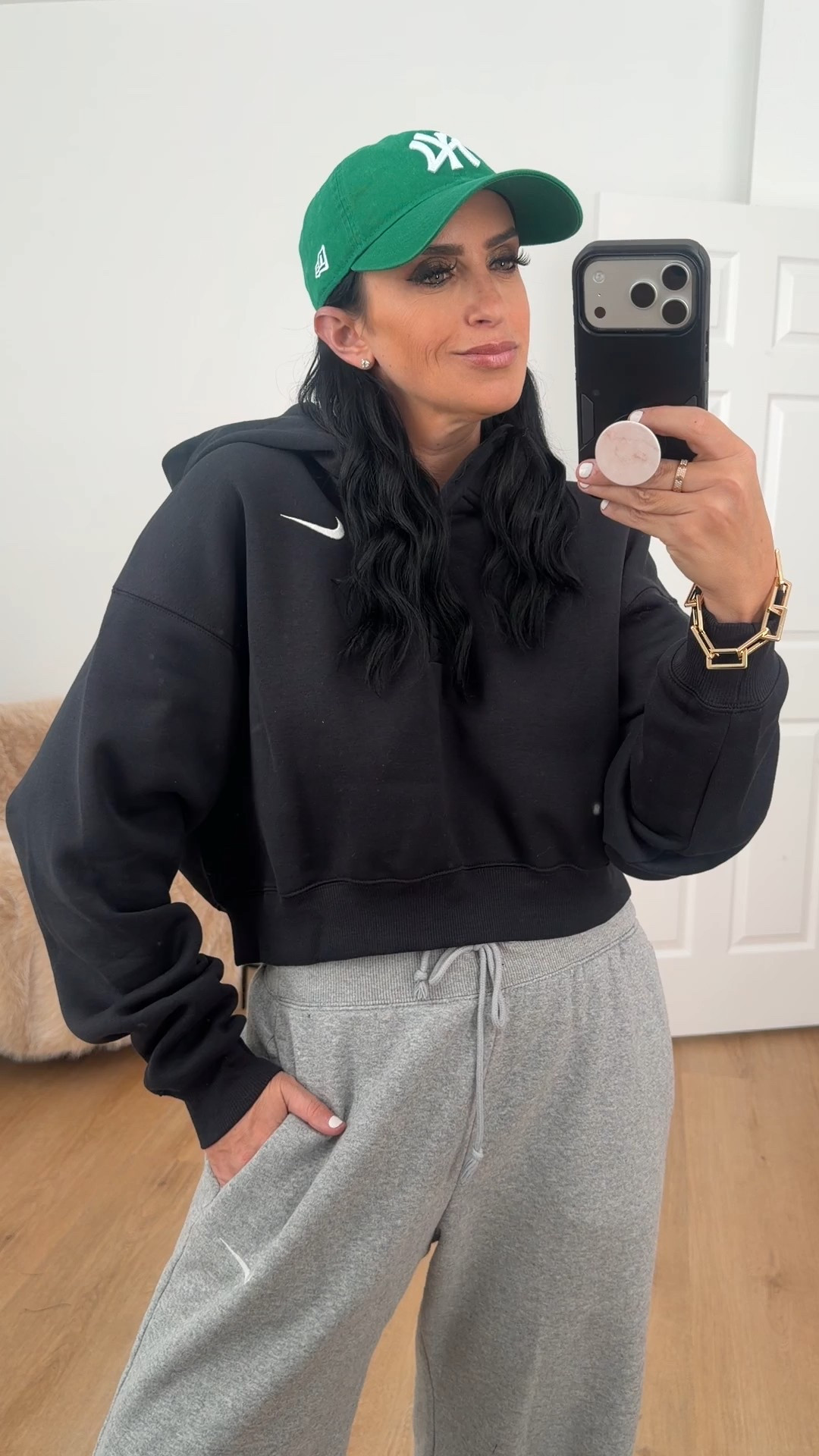 Nike Sportswear Phoenix Fleece Women's Oversized Cropped Henley Hoodie wearing size medium. 