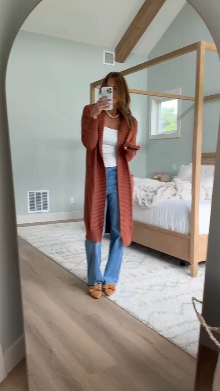 This rust cardigan is giving me all the fall color I want while still working with the tank and jeans I’m wearing right now. The longer length is SO good at 6’ tall, and I love the ribbed detailing along the cuffs and front for a little something different.

Tall girl cardigan, Rust cardigan, Long cardigan, Fall cardigan, Tall girl style, Early fall outfit, Fall layering, Cardigan outfit, Longline cardigan, Transitional fall style, StangandCo

#LTKootd #LTKdayinmylife #LTKSeasonal