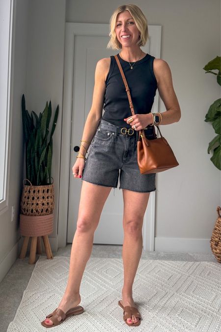 My go-to look for summer! Cotton ribbed tank, long denim shorts, leather slides, crossbody bag 

wearing my tts small in the tank (I have a few color ways) sizes up 1 in the shorts for a relaxed fit. 

#LTKOver40 #LTKxMadewell #LTKFindsUnder100