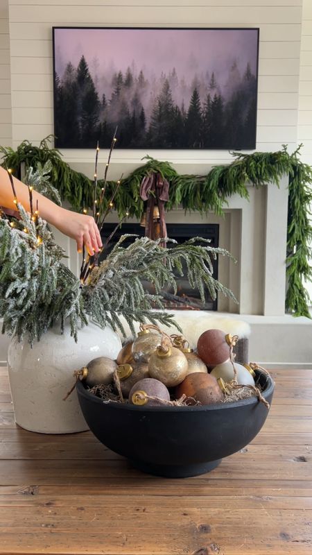 Coffee table, Christmas ornaments, bowl, vase, Norfolk stems 

#LTKSeasonal #LTKHoliday #LTKVideo