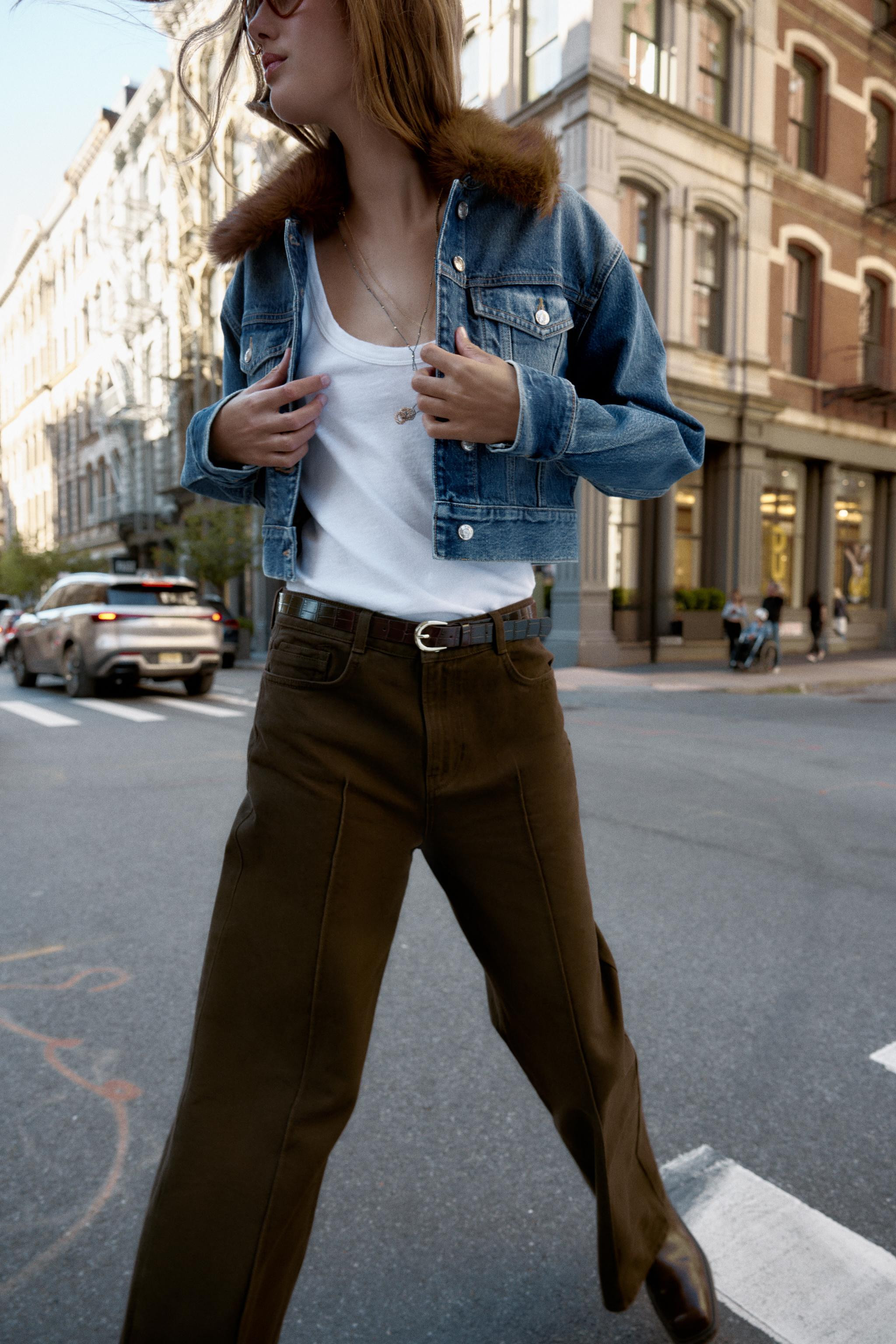 Lapel collar bomber jacket with long sleeves. Pleated hem detail. Front metal zip closure. | Zara US