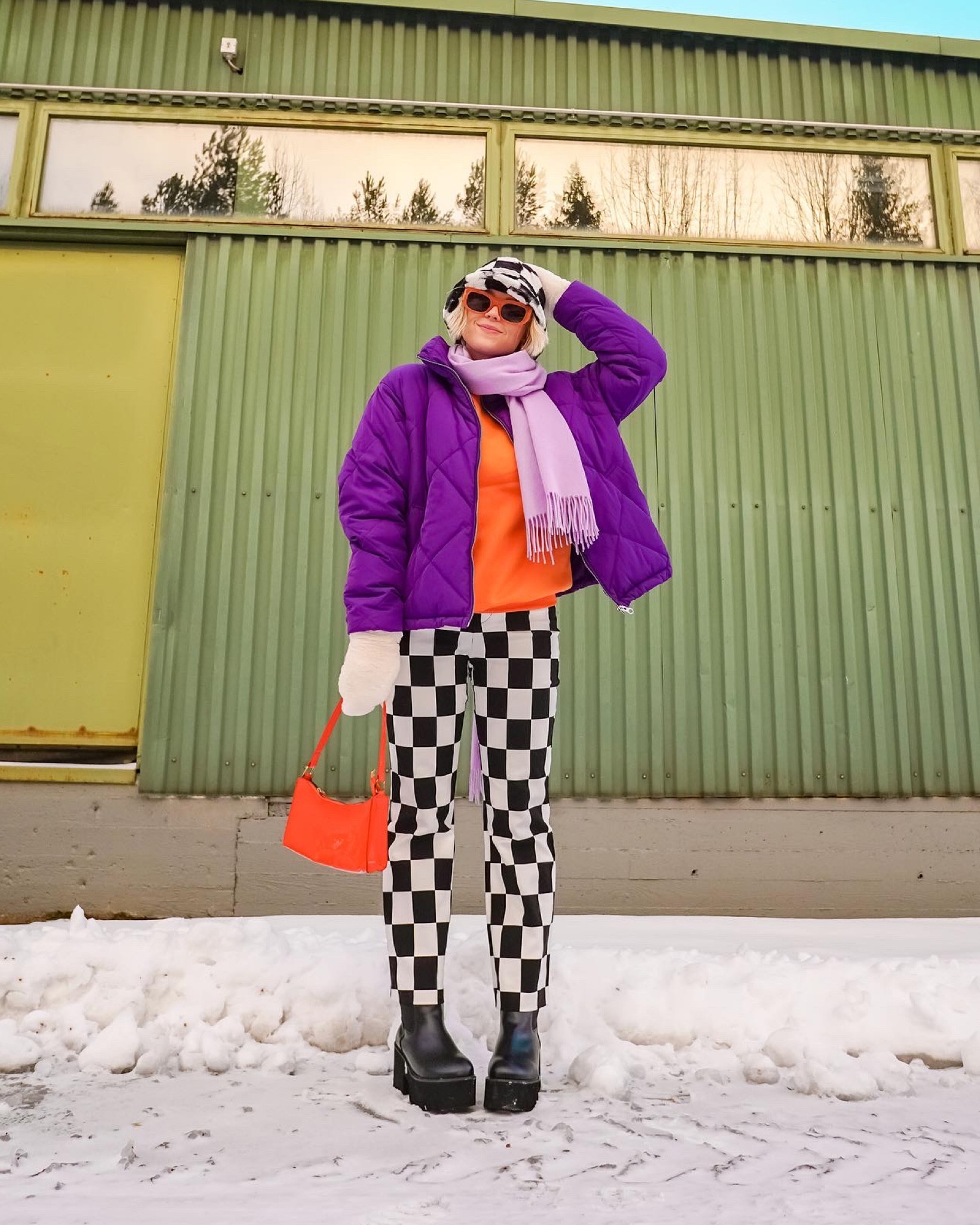 Colorful checkered winter outfit. Purple coat with orange details and black and white check print. 

#LTKstyletip #LTKSeasonal #LTKeurope