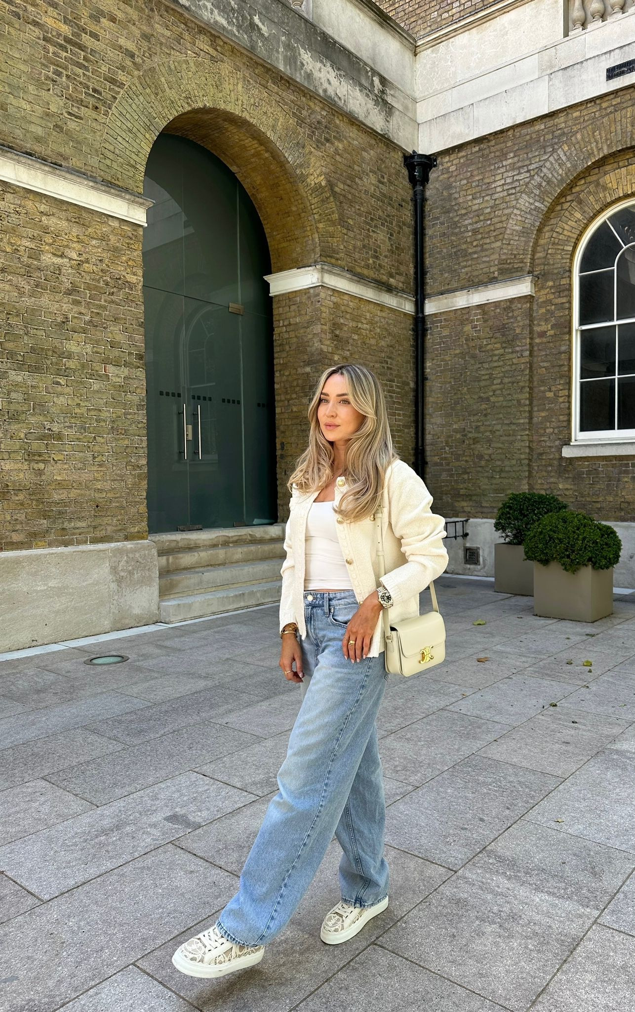 Boucle cream cardigan from H&M styled with a white vest top, wide leg blue jeans, cream Chloe Lauren lace trainers & Celine cream teen triomphe handbag. 

#LTKstyletip #LTKeurope #LTKSeasonal