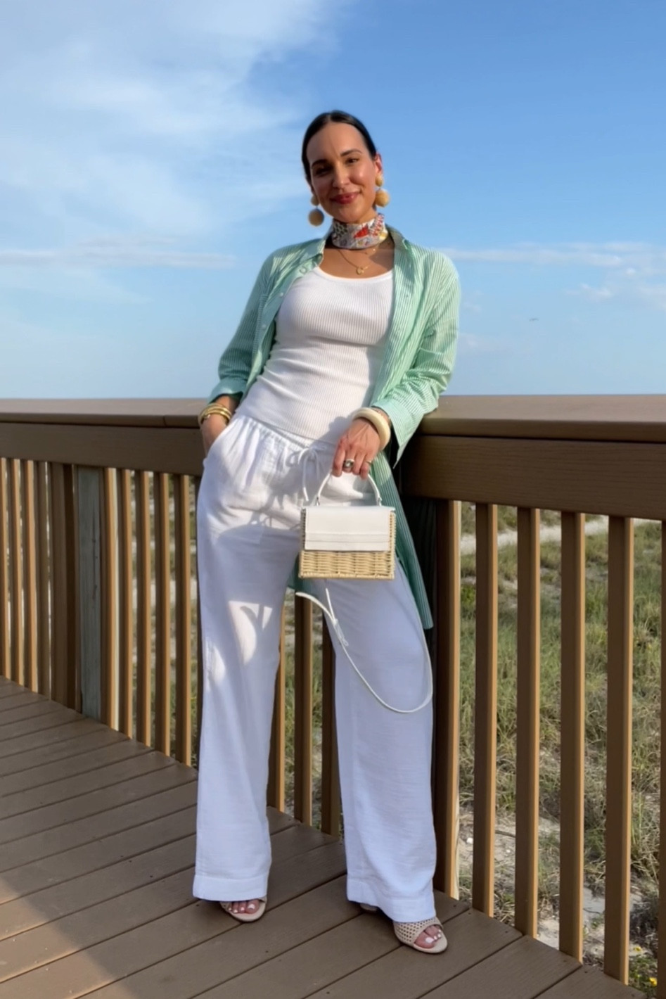 Green striped shirt dress, white gauzy pants, wicker handbag 

Sizing runs a little big. I’m wearing my usual size at 5M pregnant 
