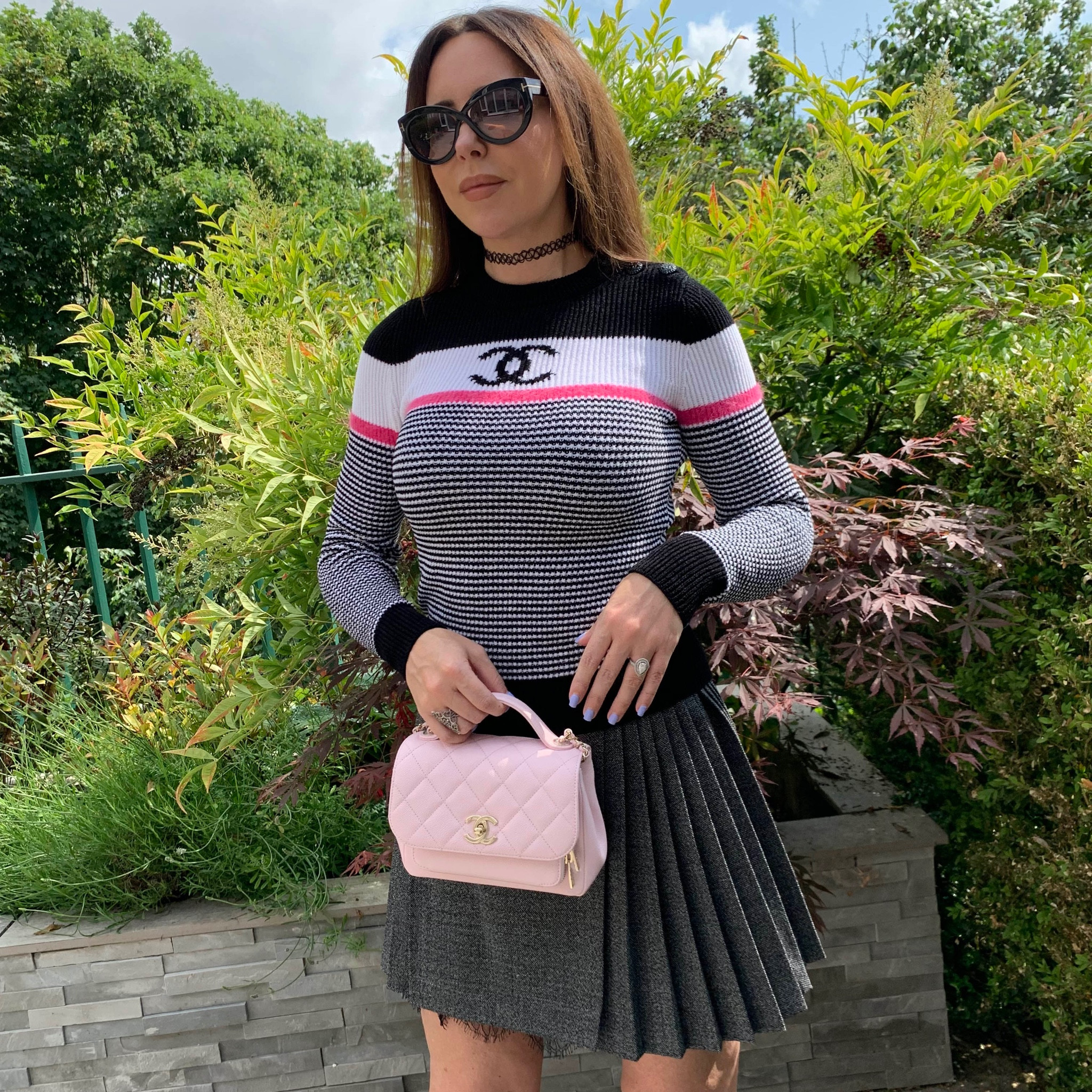 Striped ribbed long sleeve chanel knit sweater, pleated skirt, pink quilted chanel handbag

#LTKSeasonal #LTKstyletip #LTKeurope