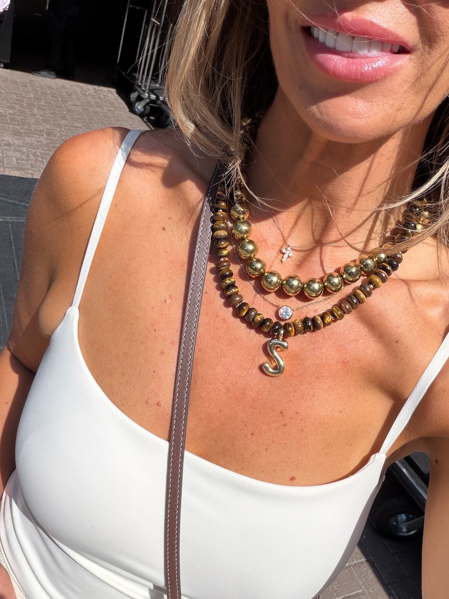 The layered necklaces make the whole look, especially the mix of warm gold beads, tiger eye tones, and the oversized initial pendant. I love how each strand has its own texture but still layers together so naturally.

layered necklaces, beaded necklace, initial necklace, gold jewelry, statement necklace, pendant necklace, everyday jewelry, necklace stack, fall accessories, TheMomInStyle

#LTKdayinmylife #LTKootd #LTKOver40