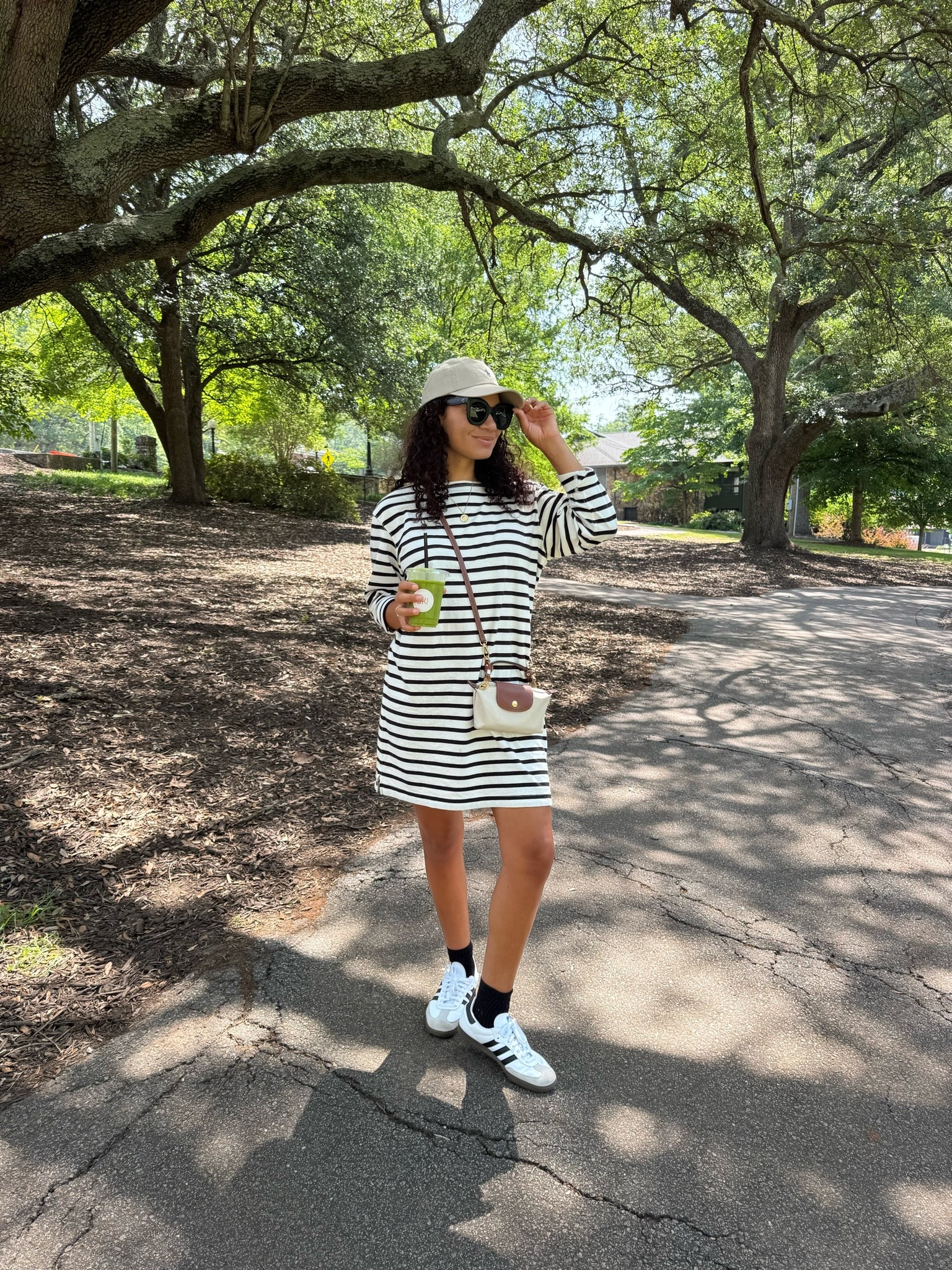 Cute casual summer outfit: striped dress, sneakers, baseball cap, and crossbody bag

#LTKootd