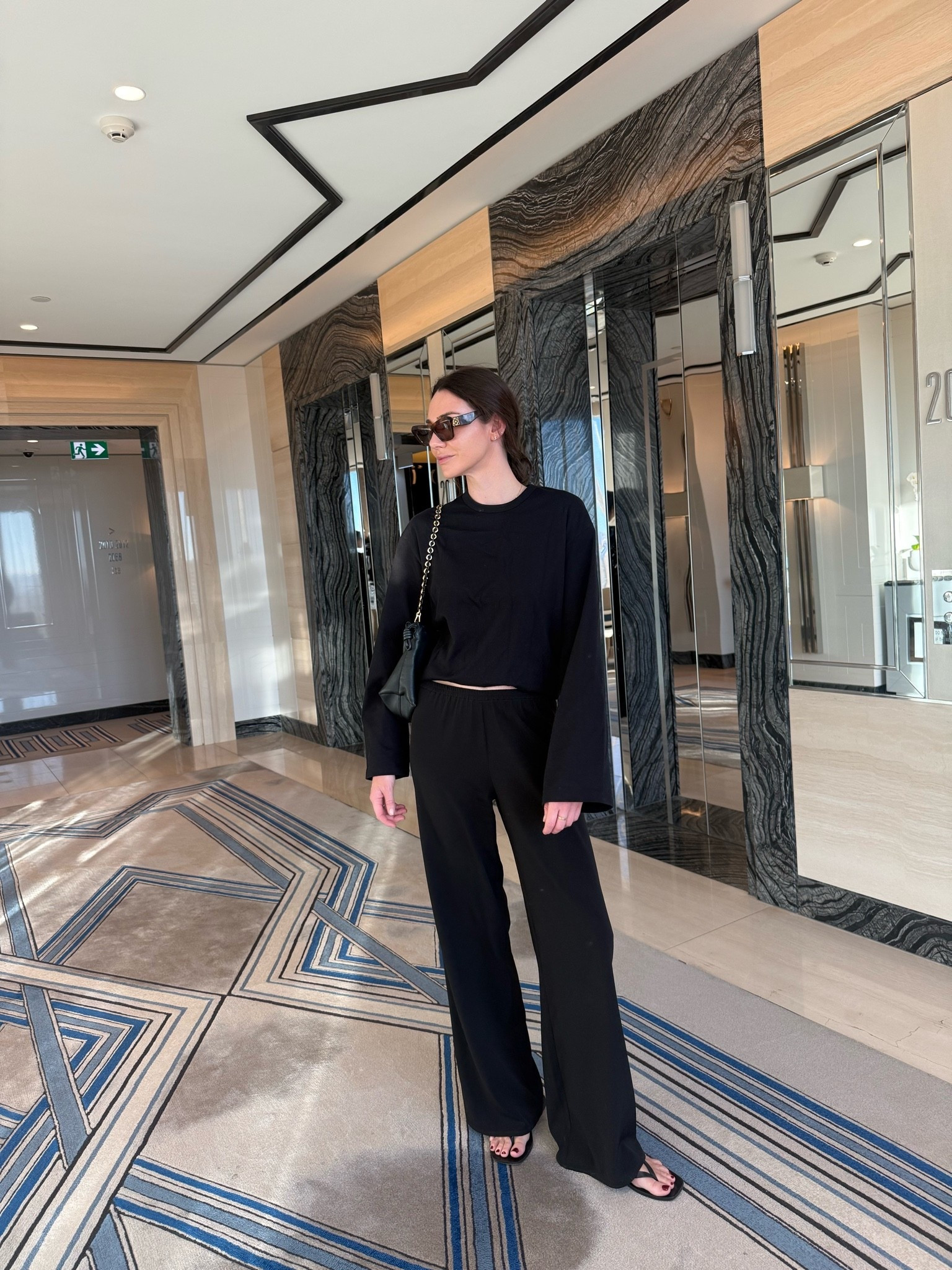 Travel day but keep it chic. 

Black trousers 
Long sleeve top 
Loewe cat eye sunglasses 
Loewe large black leather bag 
Black leather thongs

#LTKaustralia #LTKautumn #LTKstyletip