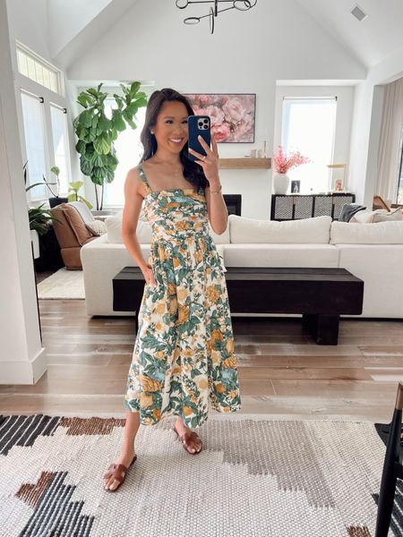 Wide strap yellow floral midi dress that is stunning! Wearing size XS and is on sale for 20% off plus an additional 15% off with code DRESSFEST! I love the length, the tiered skirt, that it has pockets and how flattering it is on! 

#LTKStyleTip #LTKSaleAlert #LTKSeasonal