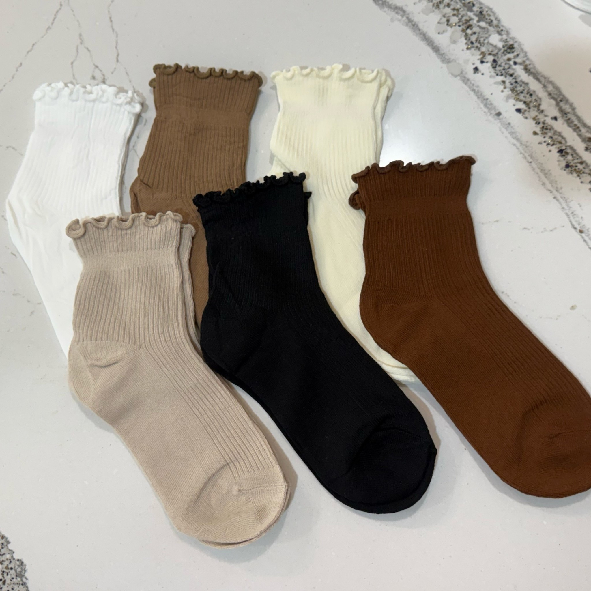 Women’s neutral ruffle socks 

Nude 
Brown 
White 
Cream 
Black 
Socks

#LTKmomlife #LTKootd #LTKSaleAlert