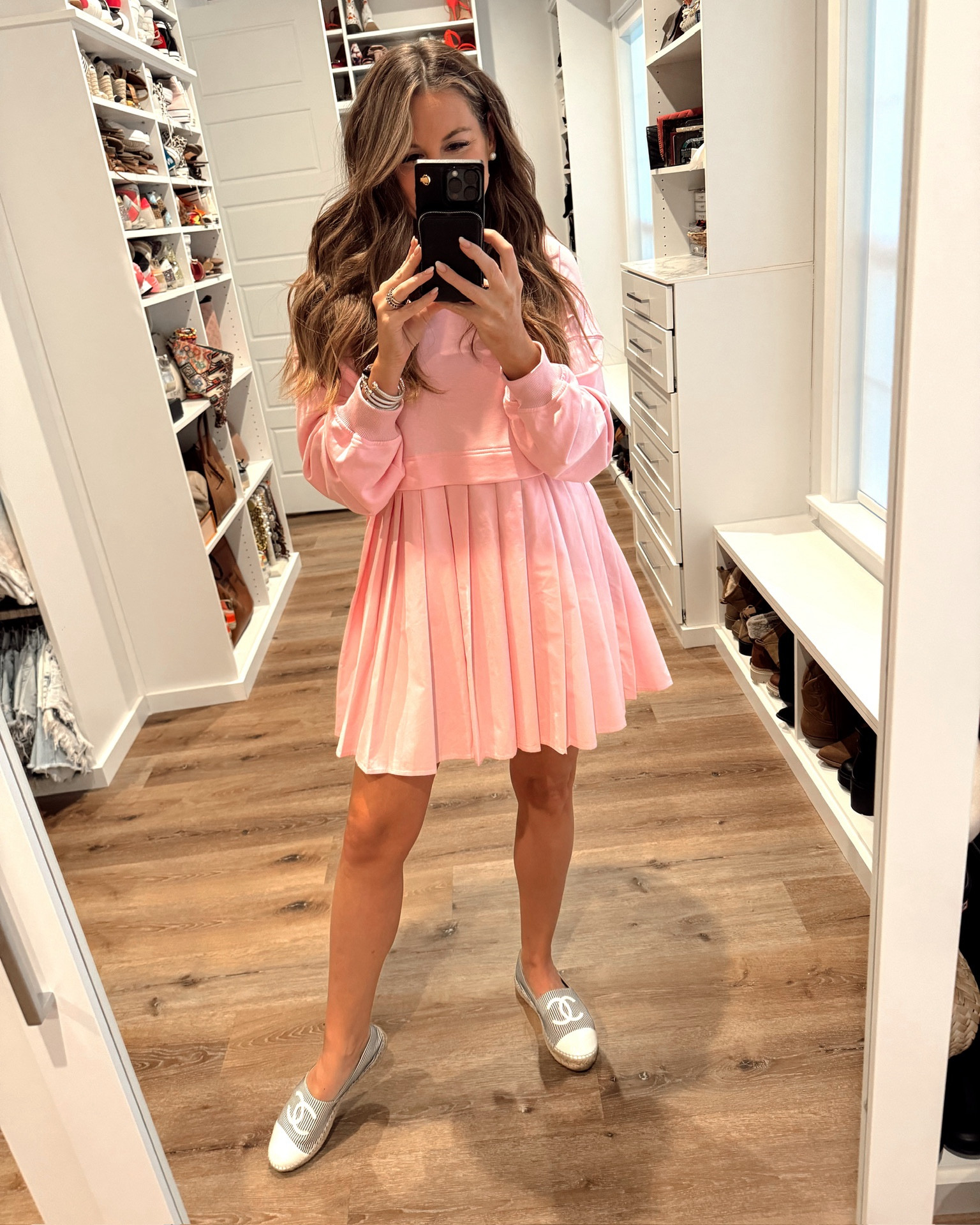 In a small pink sweatshirt dress with pleated bottom, espadrille flats and accessories for Florida winter  / spring outfit. 

#LTKfindsunder50 #LTKSeasonal #LTKstyletip