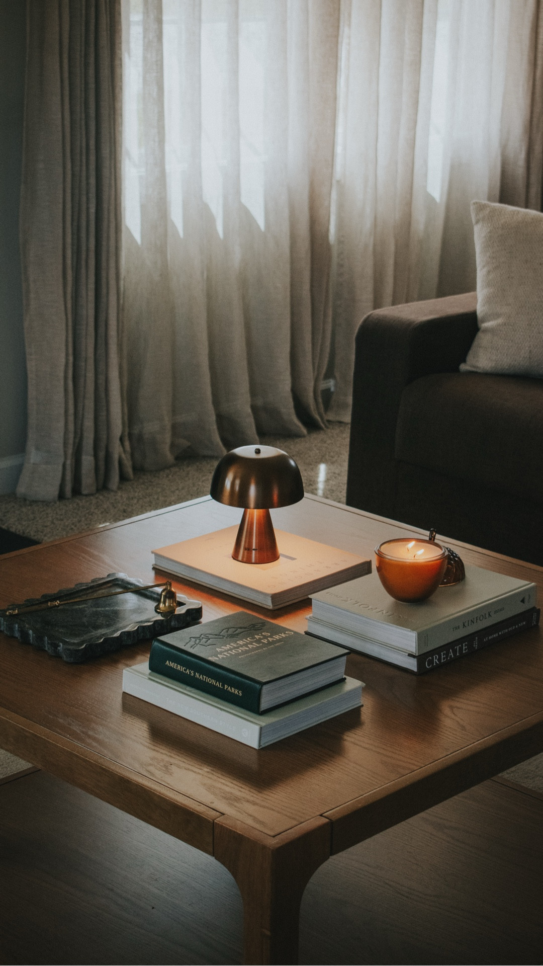 In my home 🏡 coffee table styling - books, tray, brass mini lamp, candle for a simple organic modern vibe  

#LTKStyleTip #LTKHome #LTKSaleAlert