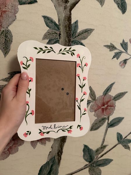 Just in the cutest hand painted floral picture frame I bought for my daughter’s nursery! She does personalization or you can get with just flowers and comes in a few different colors! I thought this was such a fun touch with her wallpaper and can’t wait to add some photos to her room! 🩷

#LTKFindsUnder50 #LTKHome