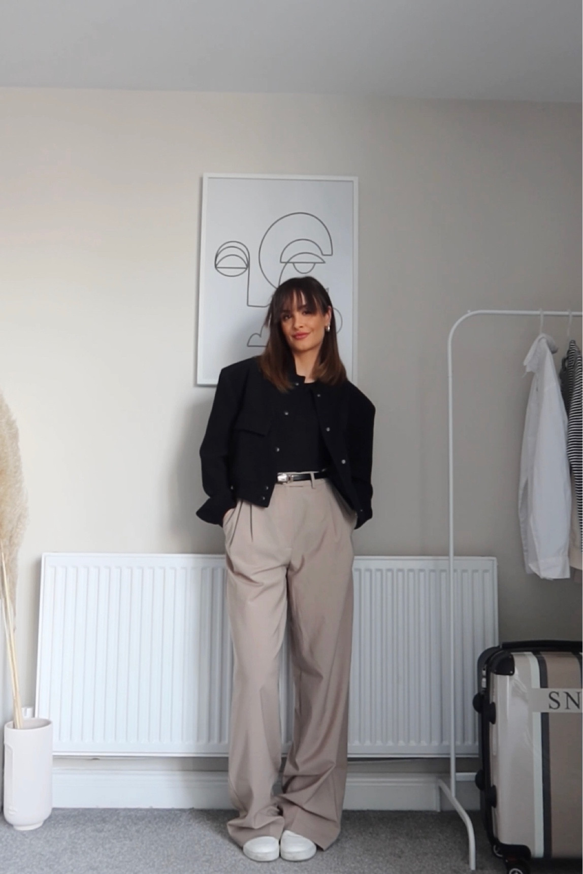 Black bomber jacket, beige formal trousers, black belt, white trousers 

#LTKSeasonal #LTKstyletip #LTKeurope