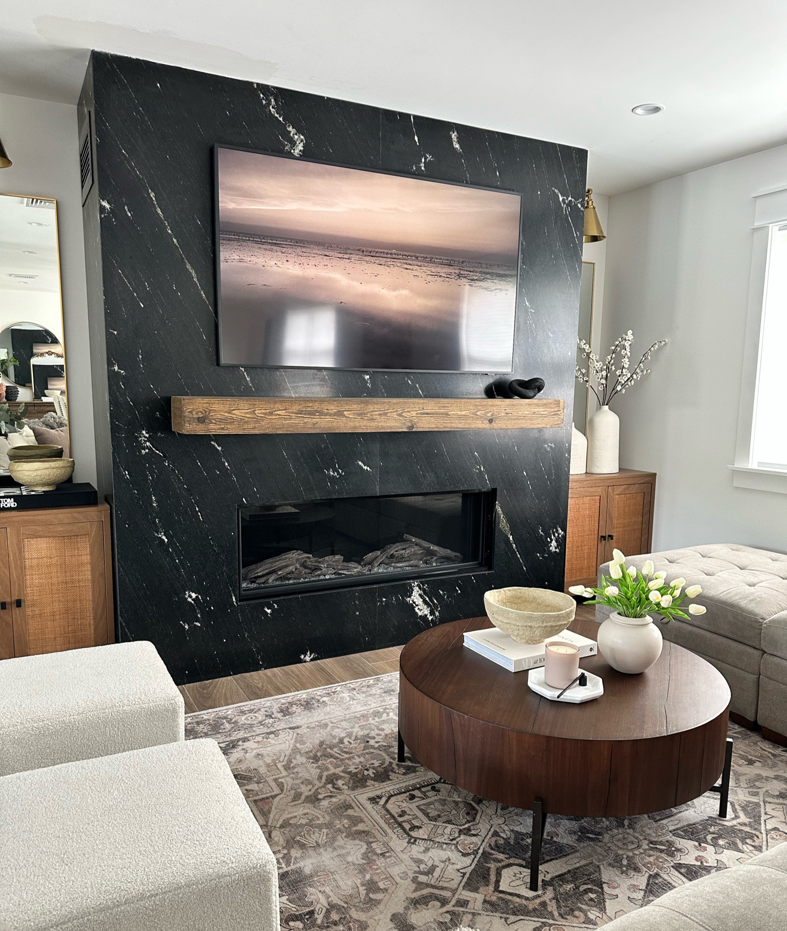 Living room views, pottery barn coffee table, Samsung frame tv, paper mache bowl, white vase, cream vase, cube ottomans, Ruggable rug, white tulips, beige vase, modular sofa coffee table book, home decor 

#LTKhome