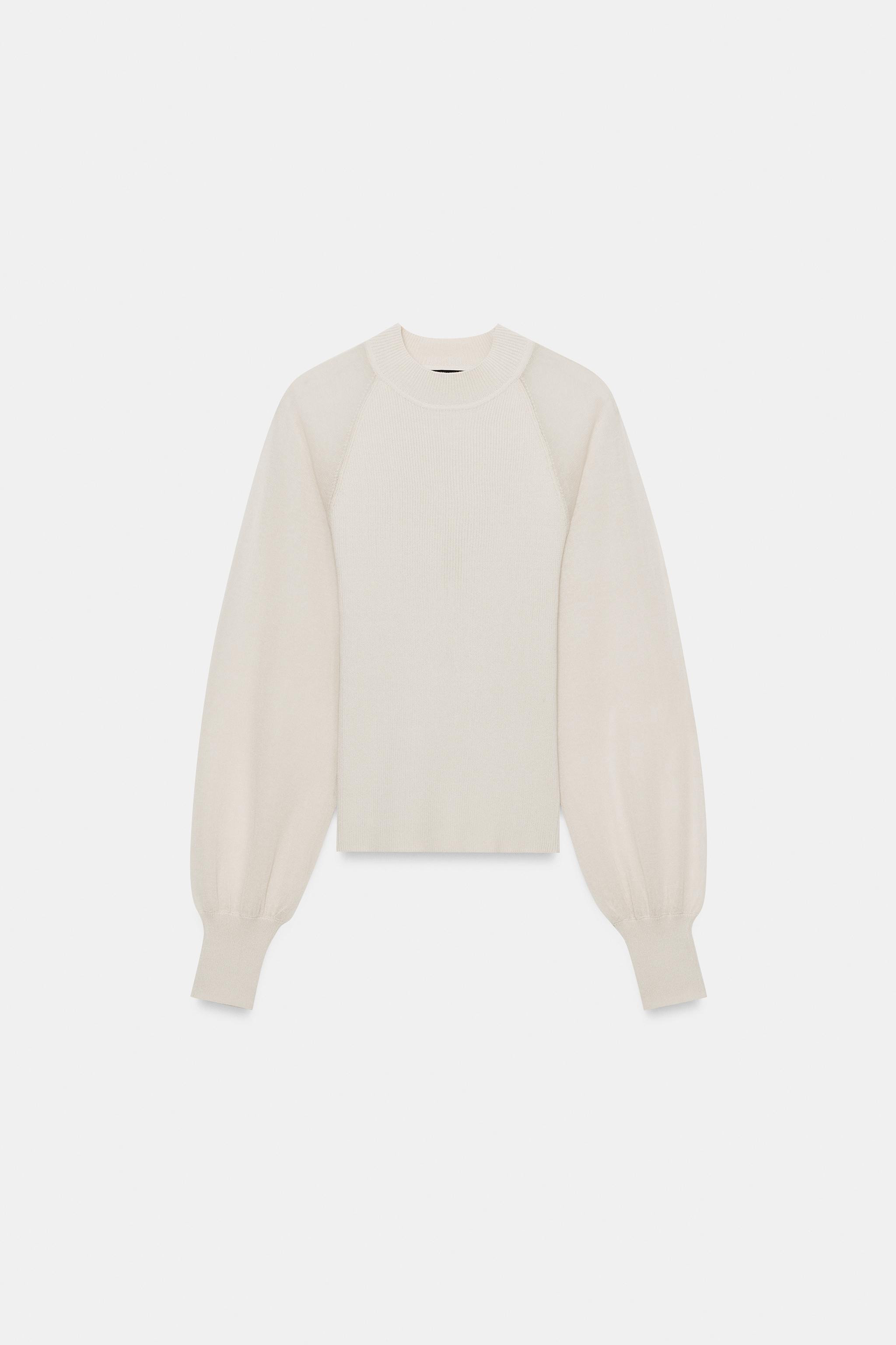 Round neck jumper with long semi-sheer contrast sleeves finished with cuffs. | Zara US