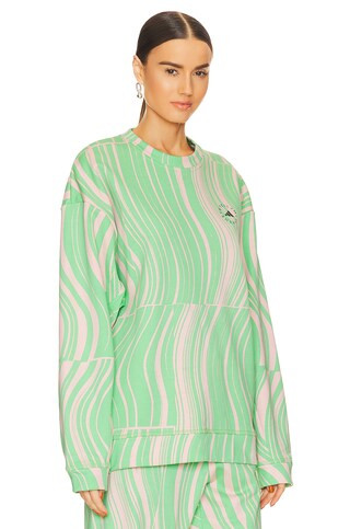 adidas by Stella McCartney True Casuals Sweatshirt in Screaming Green & Blush Pink from Revolve.c... | Revolve Clothing (Global)