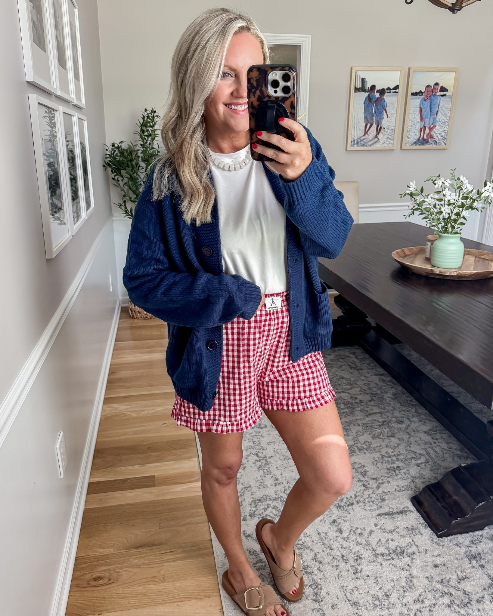This outfit gives all the classic summer Americana vibes in the best way 🇺🇸 The red gingham shorts paired with the navy cardigan feel so timeless and cute for chilly summer mornings, beach trips, and holiday weekends.

summer outfit idea, gingham shorts outfit, patriotic style, americana fashion, casual cute outfit, navy cardigan outfit, fourth of july style, memorial day outfit, comfy summer fashion, affordable amazon fashion, everyday summer look, red white and blue outfit, lovelylifestyling

#LTKTravel #LTKSeasonal #LTKootd