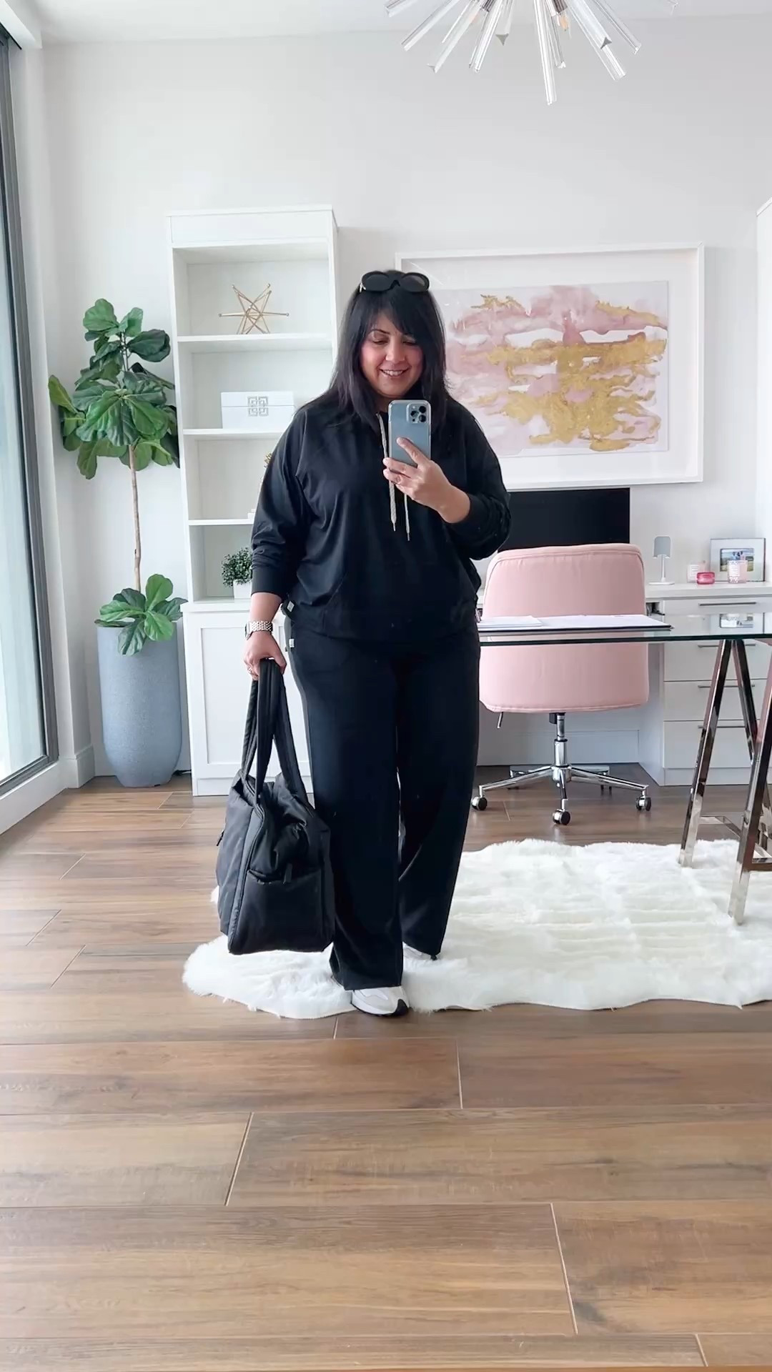 Travel outfit! Vuori Halo oversized hoodie and Halo Essential Wide Leg pants size large. The material is so unbelievably soft and comfortable and it’s very lightweight so it’s not too hot for the Warner months. New Balance 327 sneakers true to size. Celine sunglasses. CALPAK Luka duffel bag. 

#LTKFallSale #LTKActive #LTKTravel