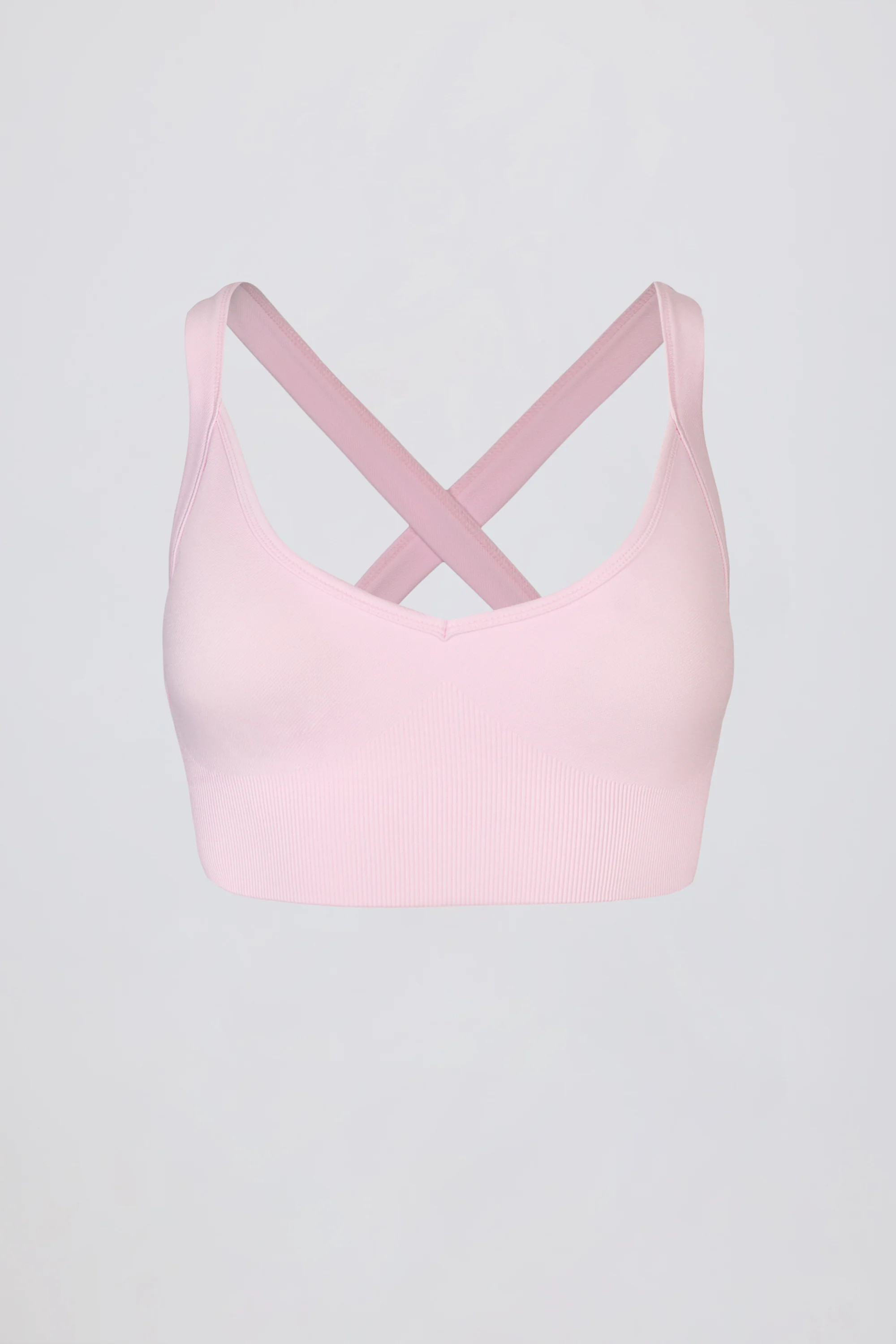 Super Sculpt Seamless Cross-Back Sports Bra in Powder Pink | Bo+Tee