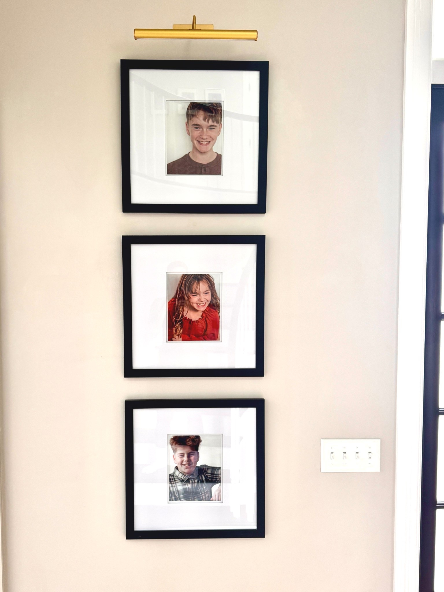 Modern photo wall with oversized matted frames and remote operated photo light. 

#LTKHome #LTKSpringSale
