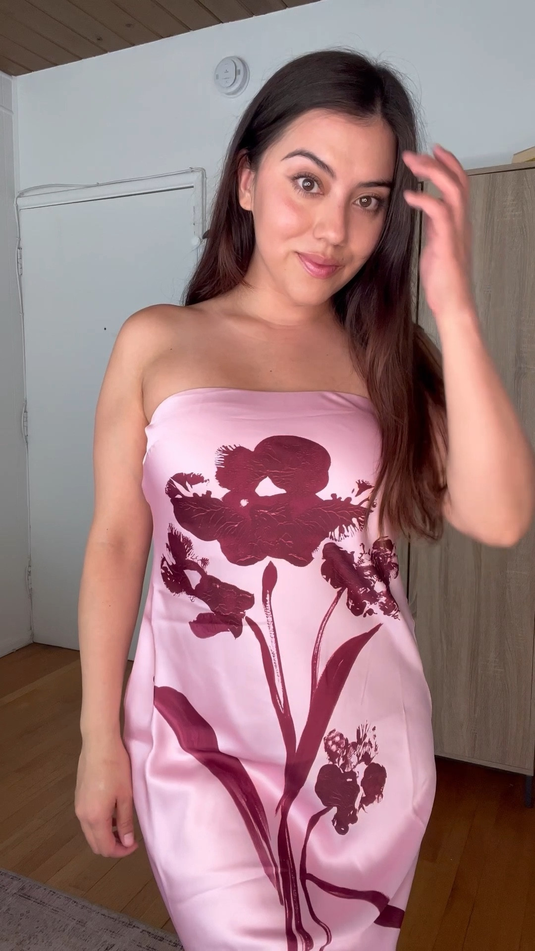 This strapless floral dress is a showstopper with its soft blush pink base and bold burgundy print—perfect for wedding season or any summer event. The sleek silhouette and botanical details make it a feminine and elegant choice for date nights or special occasions. Linking this exact look on my LTK so you can shop this chic floral dress and recreate the vibe.