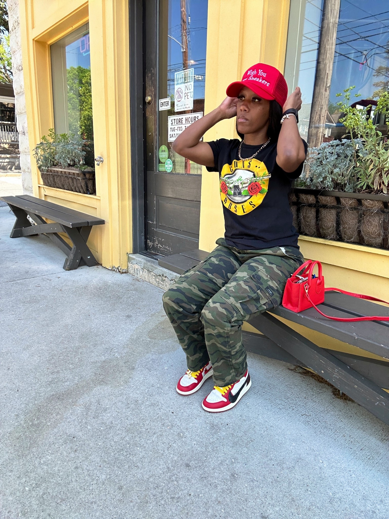 Street style inspo. I’m wearing a Guns n Roses graphic tee with camo cargo pants, red trucker hat, and red mini purse. I styled this casual outfit with Jordan 1 x Teyana Taylor sneakers

#LTKShoeCrush #LTKPetite #LTKStyleTip