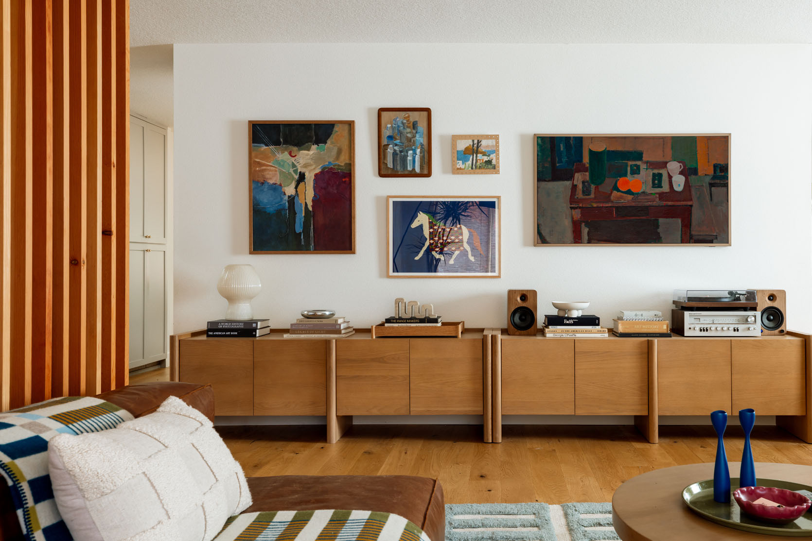 The blank wall is totally transformed – two matching media units (The Torme, from Article) created a low long built-in look that not only created a lot of record and game storage but was a great surface and grounding element for a gallery wall above. Each unit features adjustable shelves inside and soft close fronts but the real kicker are the thoughtful design details – those rounded legs and beveled doors are chef’s kiss. And yes, that is a Frame TV (non-spon, just can’t stop using them) along with a few other pieces that Kaitlin sourced from The Yo Store, Schoolhouse, World Market, plus a few vintage paintings (and Gretchen even made her that little painting up top). It’s SO GOOD.

#LTKHome #LTKGiftGuide #LTKFindsUnder100