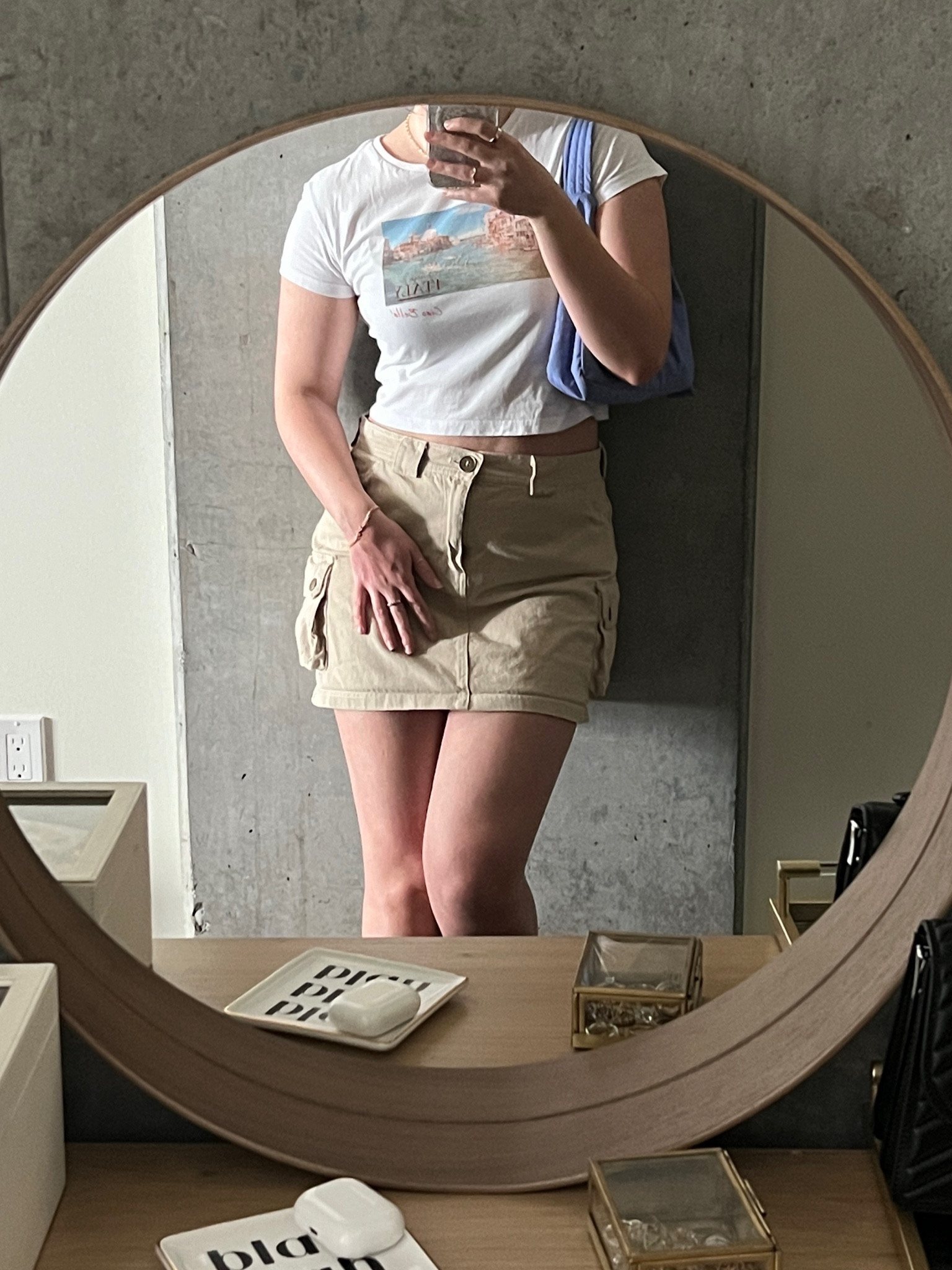 White baby tee, beige cargo skirt, blue baggu bag

#LTKSeasonal #LTKsalealert #LTKstyletip