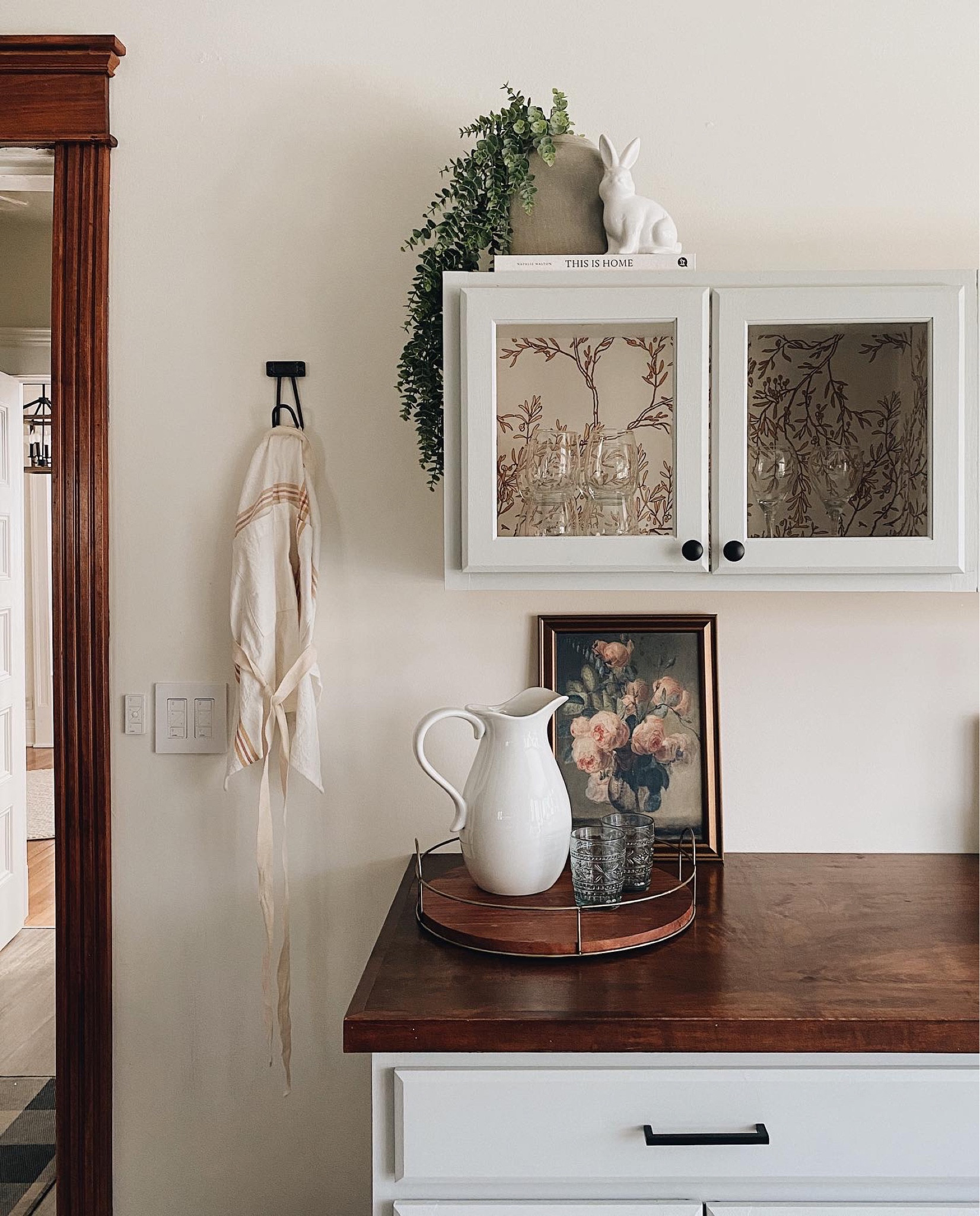Simple spring dry bar styling | kitchen counter styling for the new season! Pitcher | tray | floral artwork | chinoiserie wallpaper 

#LTKunder50 #LTKSeasonal #LTKhome
