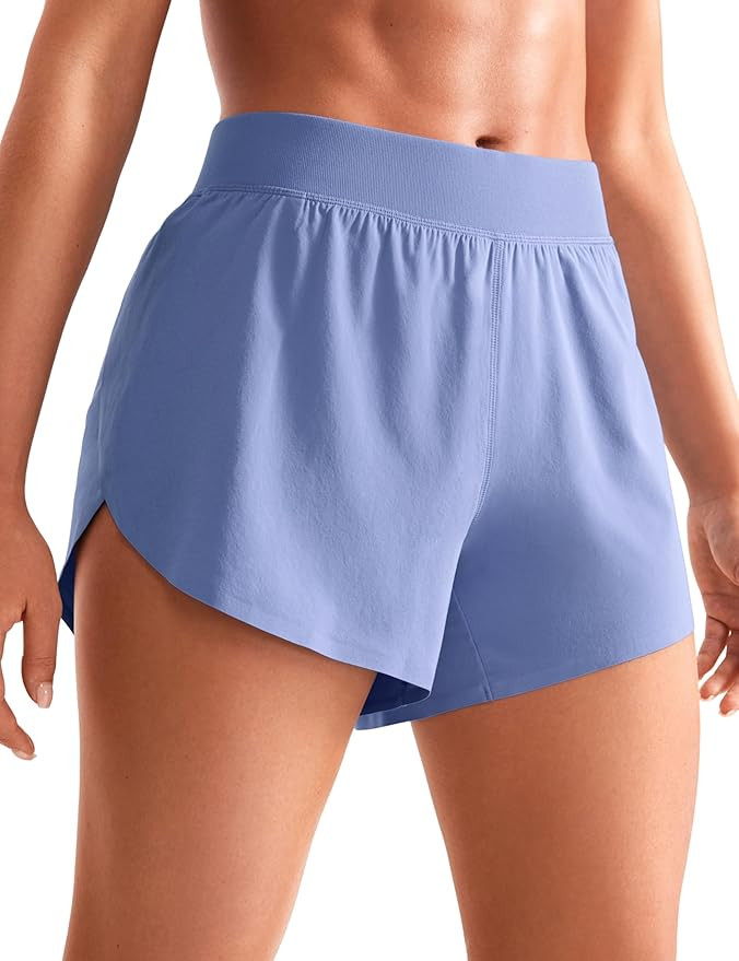 CRZ YOGA Mid Waisted Dolphin Athletic Shorts for Women 4" Lightweight High Split for Gym Workout ... | Amazon (US)