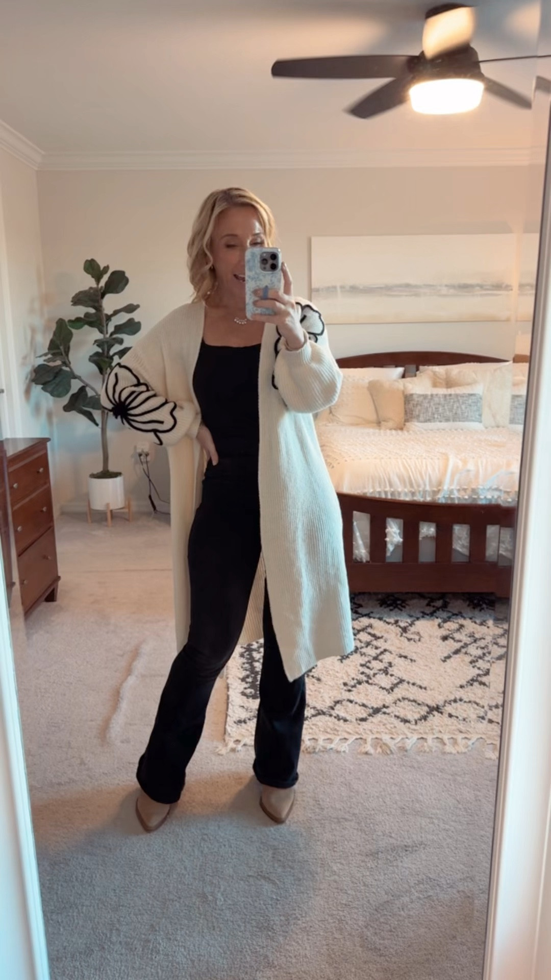 My ootd:
• cardigan - size small.
• short sleeve top (not a bodysuit) - size small.
• black flare jeans - size 4, regular length. 
• similar boots  

#LTKSeasonal #LTKOver40 #LTKWatchNow