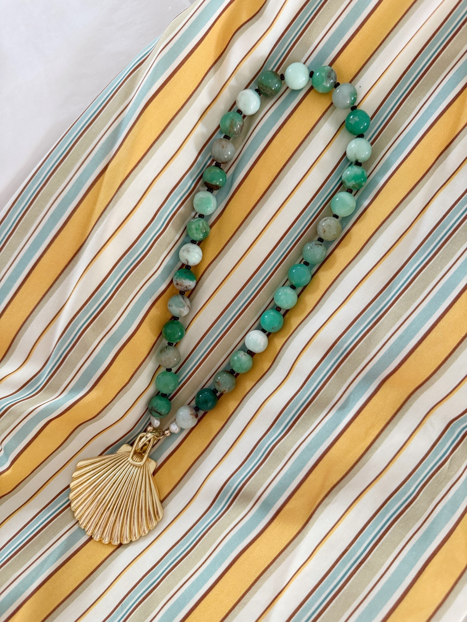 A shell necklace for summer with removable charm so you can wear it two different ways!

#LTKSeasonal