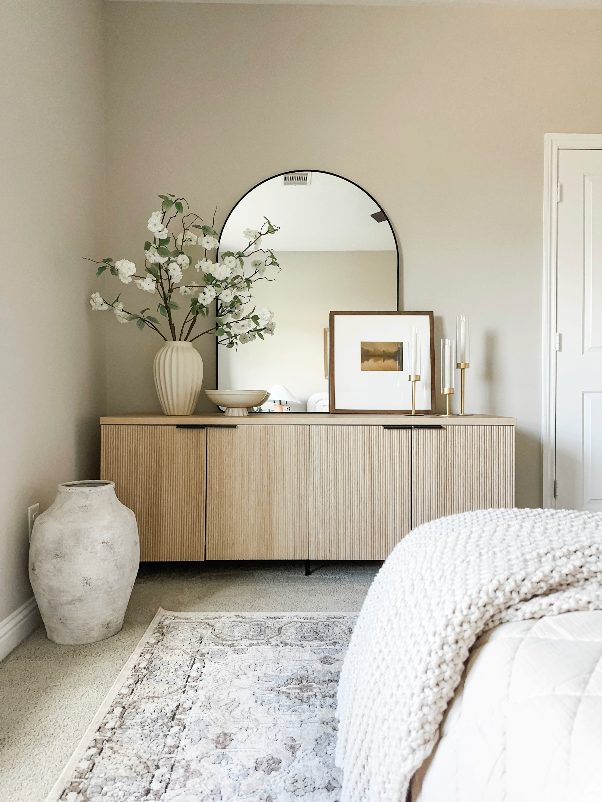 Guest Bedroom. Sale Alert! Memorial Day Sale on my fluted side board 

guest bedroom inspo, guest room cabinet, tv stand, light wood cabinet, modern cabinet, neutral room, beige room, arch mirror, beige white gray 

 

#LTKHome #LTKSaleAlert #LTKSeasonal