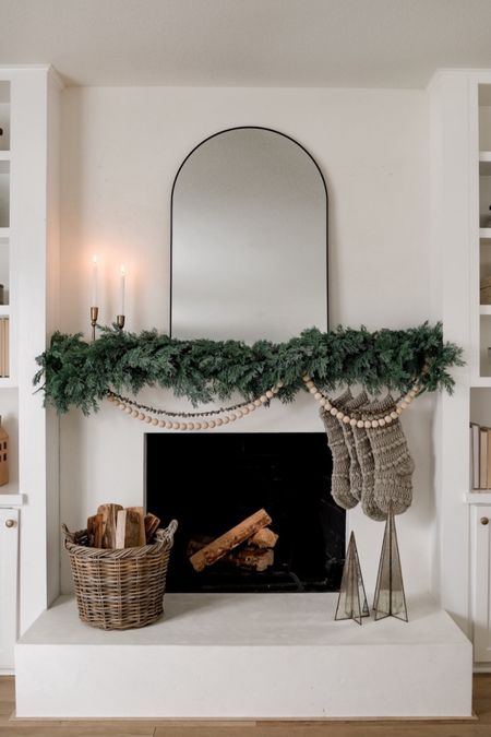 Holiday mantel styling! 

STYLING DETAILS 👇🏼

•Layered two garlands to get a fuller look, but one would work great!
•Only needed one bell garland and one wood ball garland here.
• I used command hooks to hang everything! 

#christmas #fireplace #stockings #wayfair #holidaydecor

#LTKSeasonal #LTKhome #LTKHoliday