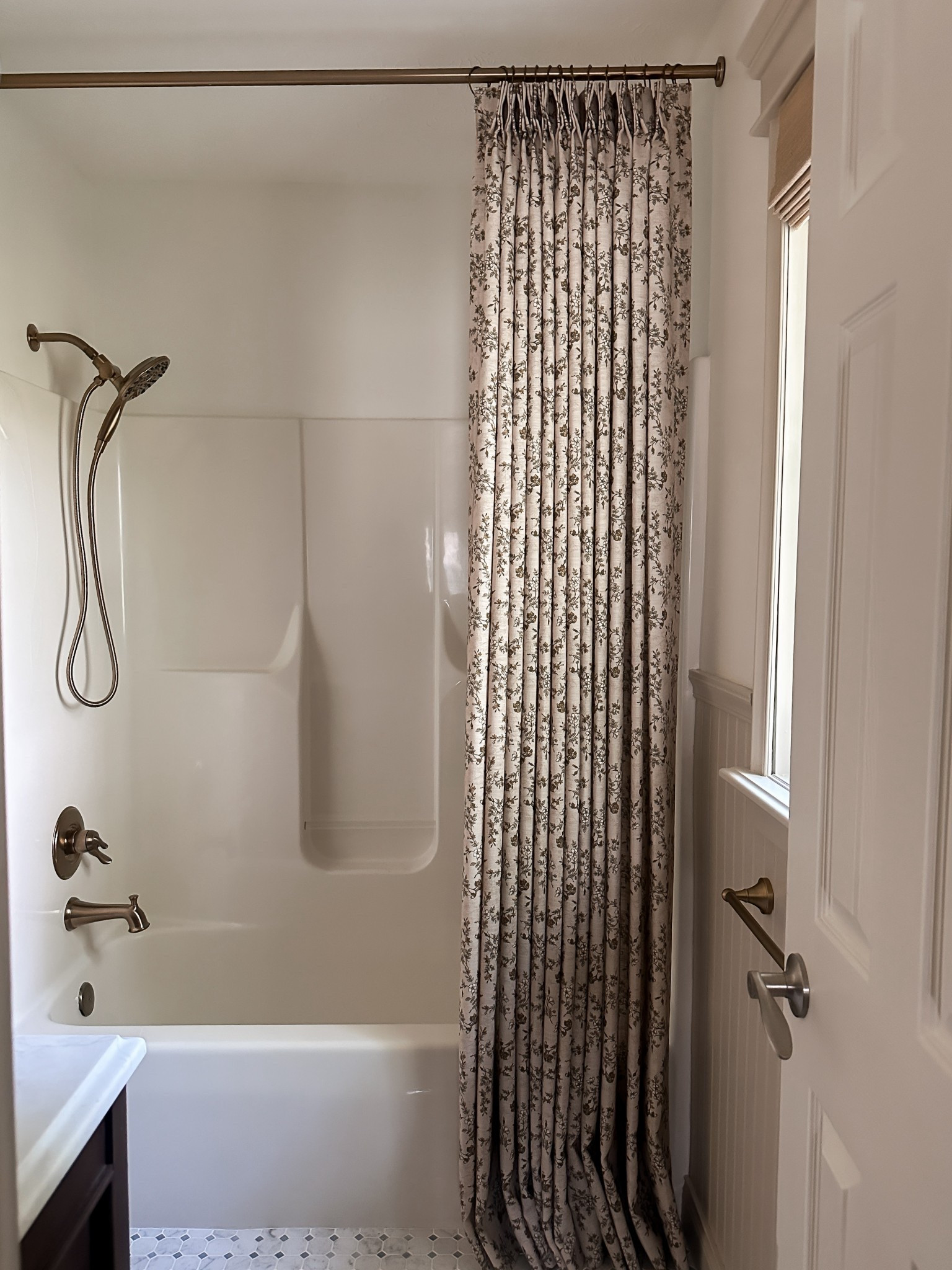 Kept the fiberglass shower, but upgraded the shower trim kit and added a pretty shower curtain!
My code MYNINETIESHOME will get you 20% off the shower curtain and the entire ©twopagescurtains website!

bathroom renovation, shower upgrades, shower trim kit, brass bathroom accessories, vintage bathroom 

#LTKHome #LTKStyleTip