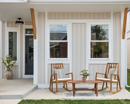Seating on the front porch creates an instant welcome to the home.

#LTKhome