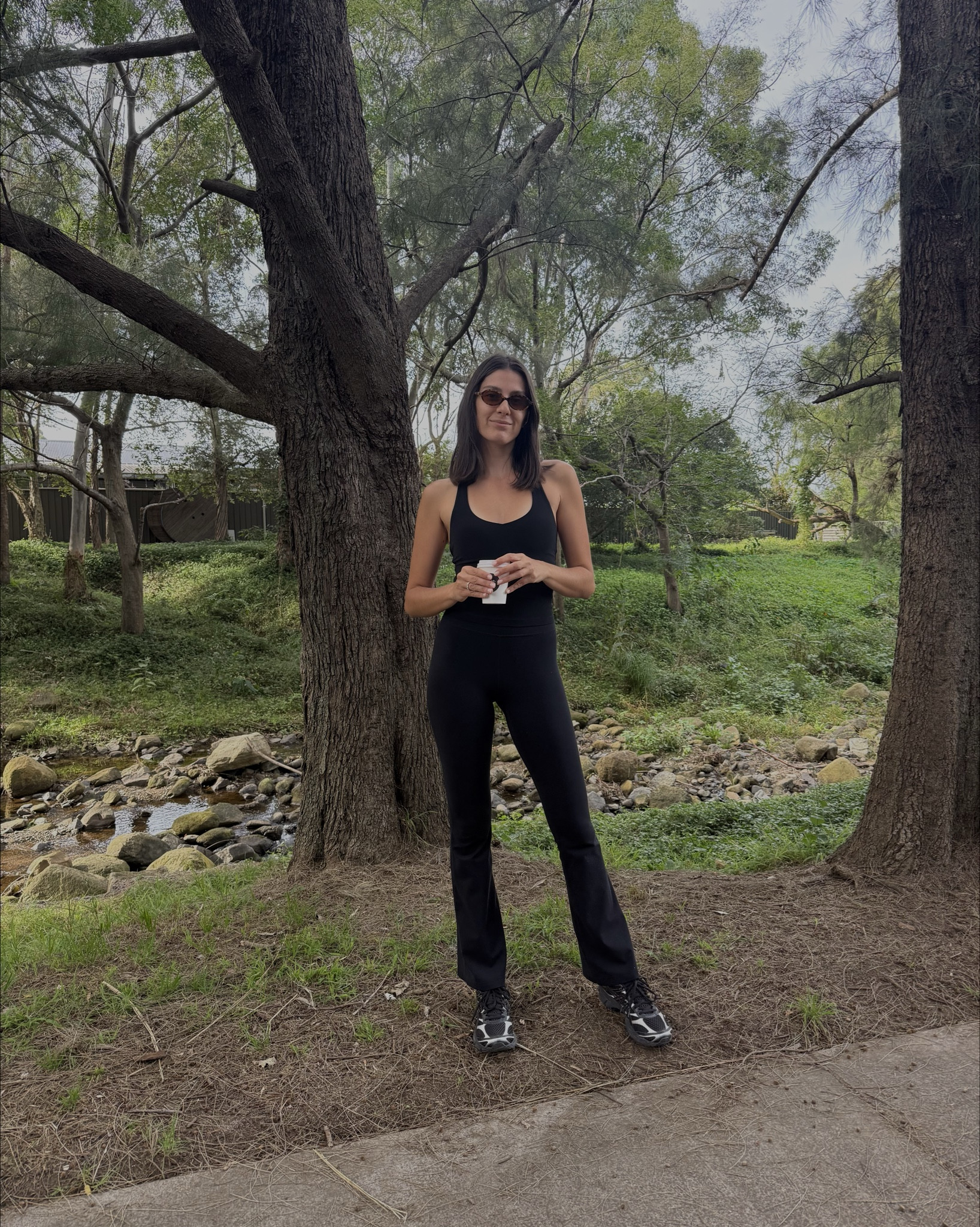 What I wore this morning for my walk with the kids 🖤 Flare pants are Nimble - size XS, the tank is Lorna Jane the Liberty Tank - also size XS. Sneakers are from ASICS. Sunglasses are MiuMiu. 