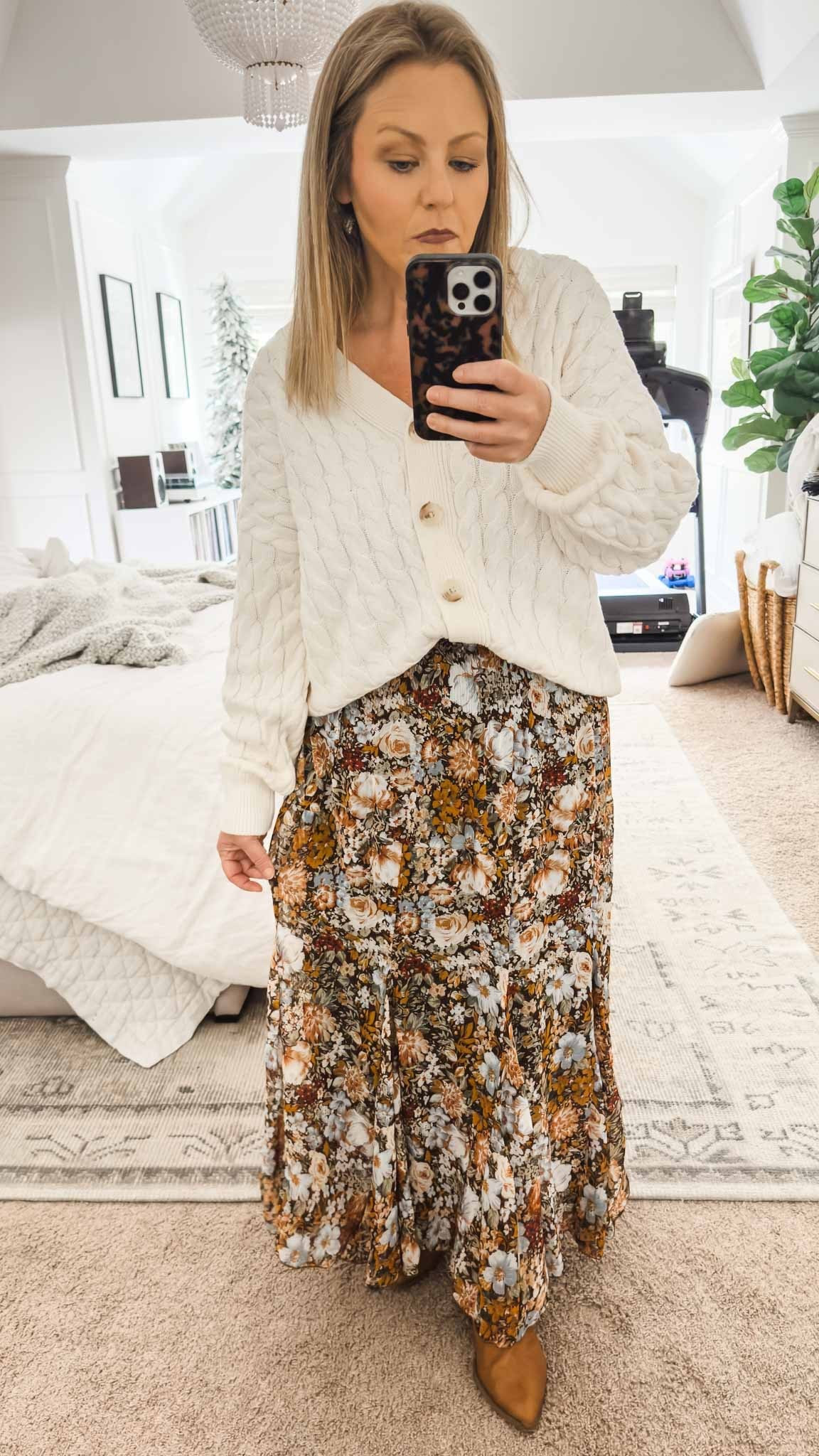The neutral colors in this floral floaty skirt are perfect for the season. I’ve topped it with this oversized cable knit cardigan and it’s the perfect outfit for any occasion, from work to church. work outfit fall outfit church outfit date night outfit work wear boots

#LTKFindsUnder50 #LTKWorkwear #LTKGiftGuide
