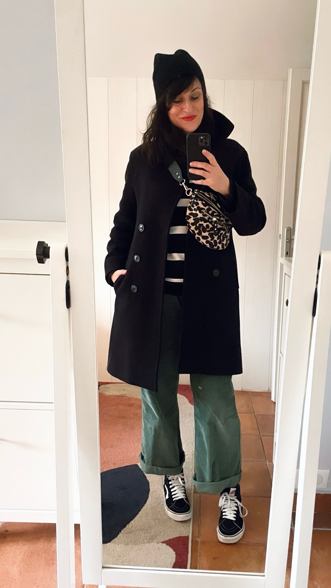 . Cashmere beanie #cos (similar, linked)
. Leopard fanny pack #petitemendigote (linked)
. Navy peacoat #pablo (similar, linked)
. Striped sweatshirt #hm (similar, linked)
. "Ciboulette" green corduroy pants, rolled up #monoprix (linked)
. Black "Sk8-Hi" sneakers #vans (linked)
. "Poppy red" lipbalm #labello (linked)

#LTKwinter #LTKmidsize #LTKfrance