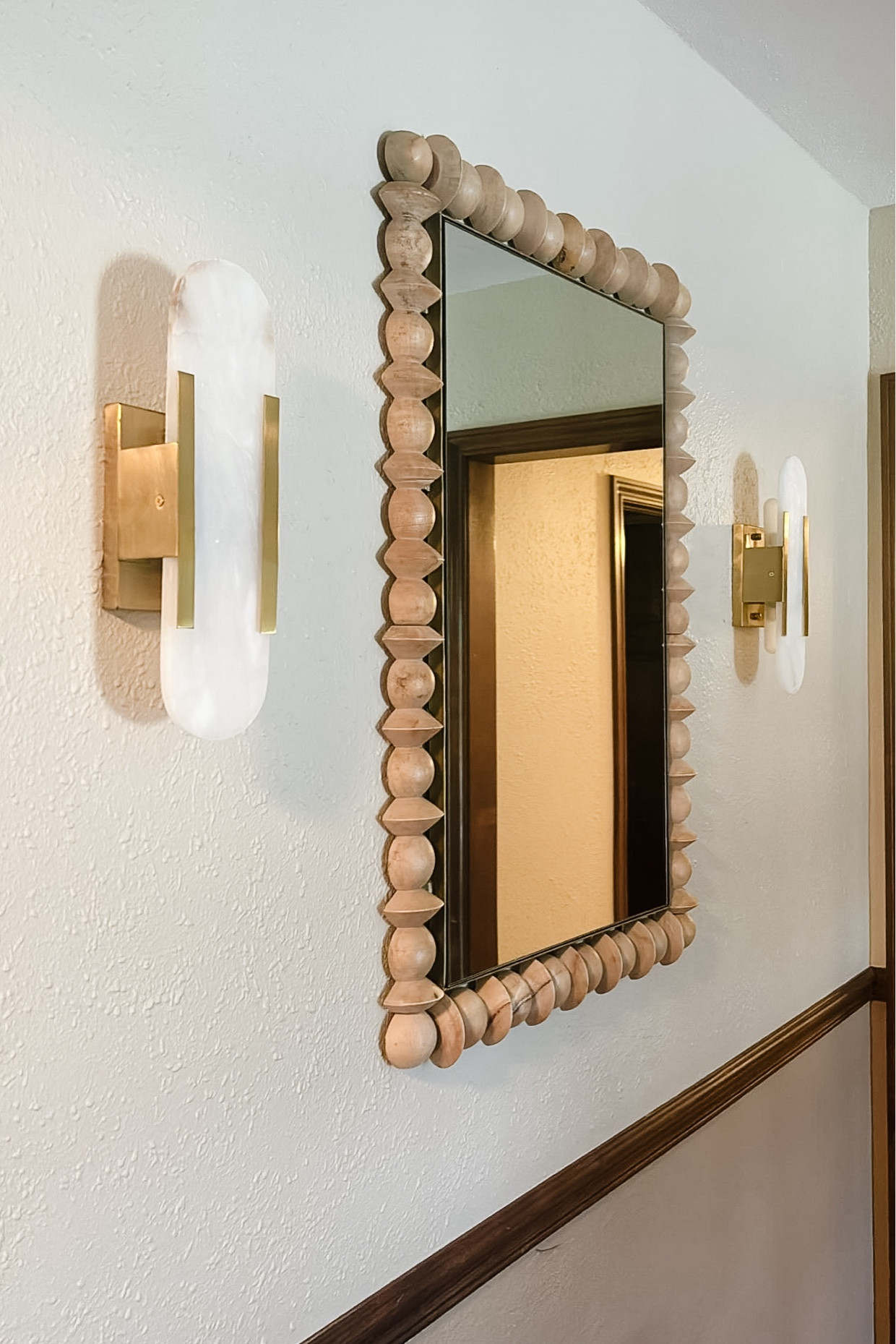 The most beautiful designer look for less sconces! These are fraction of the cost of the designer ones and look identical. Also linked this beautiful mirror. Anthropology, Wayfair, brass sconces, marble, sconces, rectangular wood mirror.

#LTKHome #LTKSaleAlert #LTKFindsUnder100