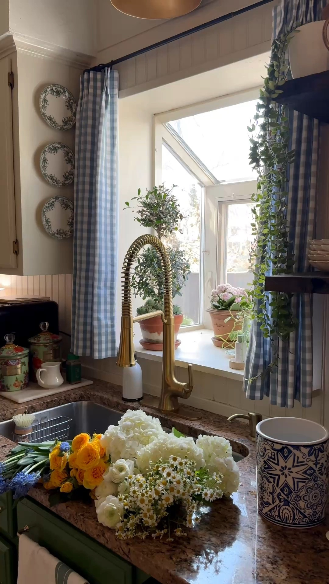 Cozy kitchen sink views… good kitchen faucet, pinch pleat blue gingham cafe curtains, green floral enamel canisters, scallop plates

#LTKSeasonal #LTKHome #LTKSaleAlert