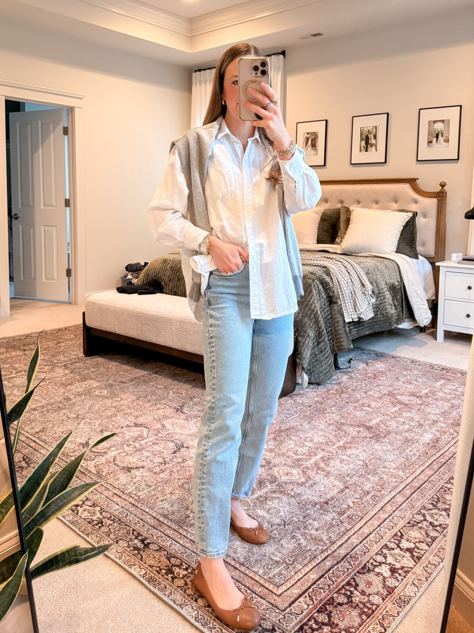 Classic spring layering outfit 🤍

• Old Navy white button down
• Abercrombie high rise loose jeans (25R)
• Grey sweater layered over shoulders
• Ralph Lauren leather flats (the perfect spring brown)

A white button down is one of the most versatile pieces in a spring capsule wardrobe. Wear it alone, layered under a sweater, or tied over your shoulders like this for a polished but relaxed look.

The light wash denim keeps it fresh for spring, and these brown leather flats add warmth without feeling heavy like black.

Perfect for:
• White button down outfit ideas
• Spring capsule wardrobe outfits
• Casual chic mom style
• Light wash jeans outfit
• Brown flats outfit
• Preppy spring outfits

This is one of those timeless combinations that never feels trendy — just elevated and easy.

#LTKootd #LTKWorkwear #LTKgrwm