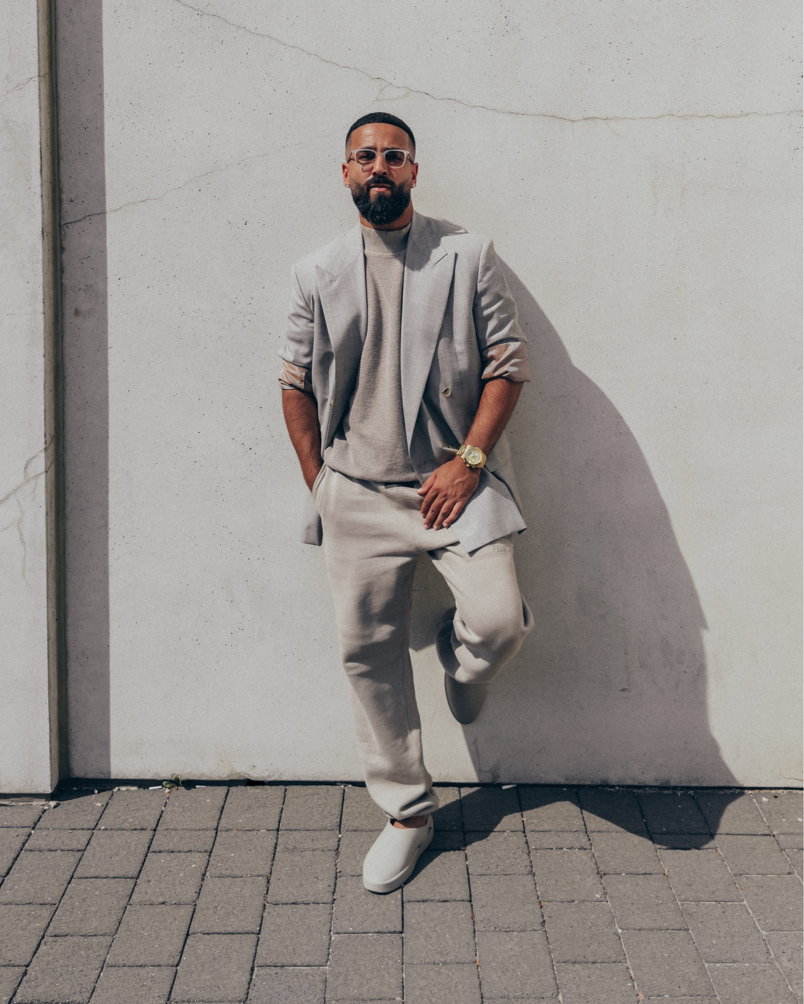 FEAR OF GOD 7th Collection California Blazer in ‘Grey’ (size 46), Inside Out Mock Neck shirt in ‘Paris Sky’ (size M), and California slides in ‘Concrete’ (size 41). ESSENTIALS sweatpants in ‘Smoke’ (size M). FEAR OF GOD x BARTON PERREIRA glasses in ‘Matte Taupe’. A relaxed and elevated men’s look that’s comfortable and in neutral tones, perfect for a dinner or night out this Spring and Summer. Exact and similar pieces from this look are on sale up to 30% off right now. 

#LTKmens #LTKstyletip #LTKsalealert