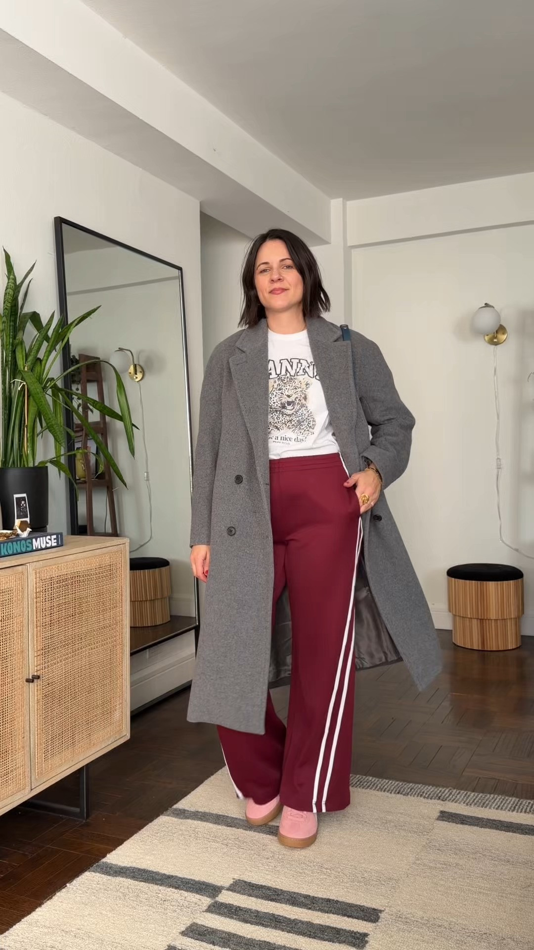 track pants styled with sneakers a graphic tee and an oversized wool coat. the perfect casual outfit for track pants 

 #LTKdayinmylife #LTKgrwm #LTKootd